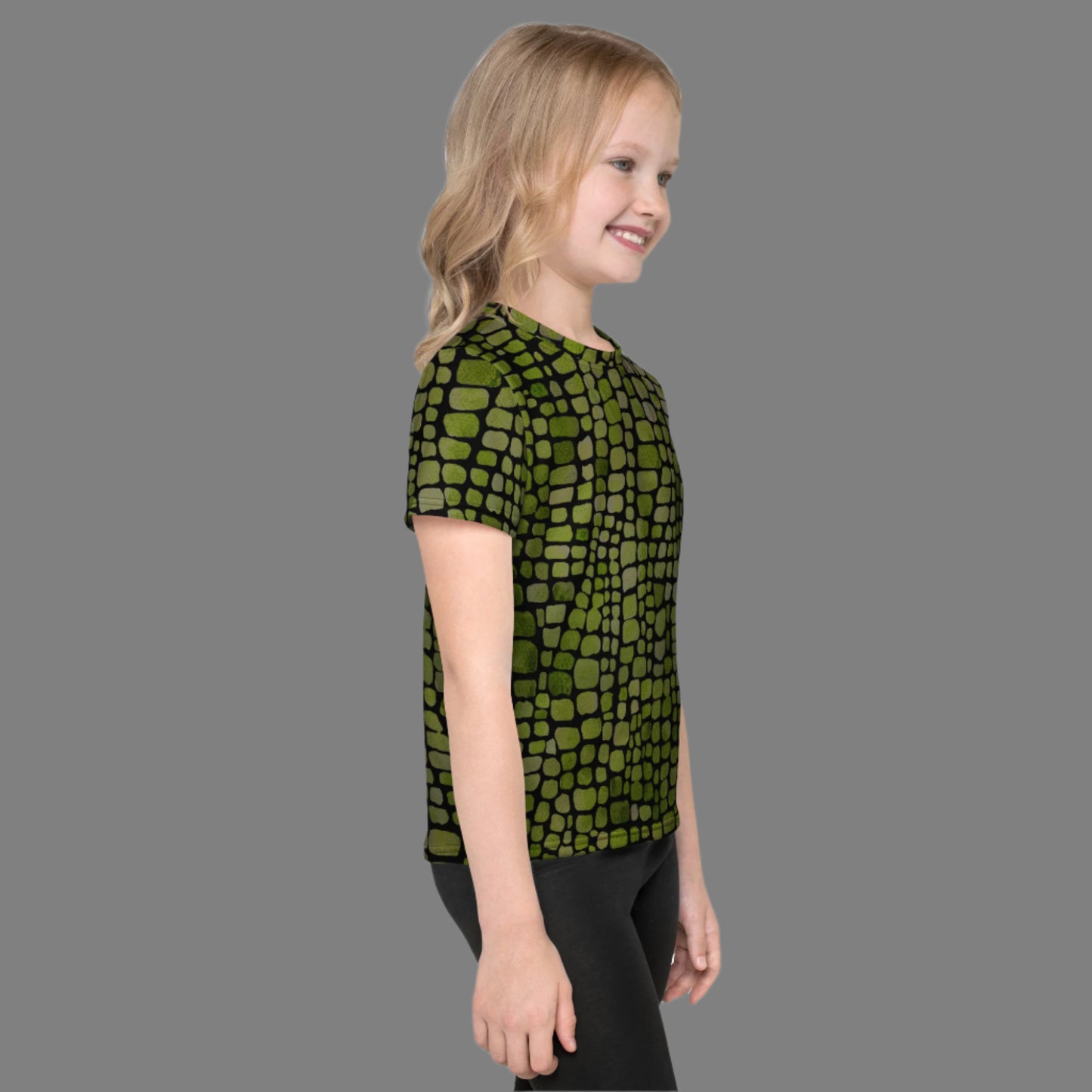 Green scale costume t-shirt for toddlers and kids, designed with an all-over reptile pattern in sizes 2T–7. Perfect for dinosaur, lizard, snake, or serpent dress-up, this comfy tee is made for Halloween, parties, or everyday play. Whether worn solo or paired with costume accessories, it’s a fun and flexible piece for animal lovers and creative kids. Lightweight and playful for any occasion.