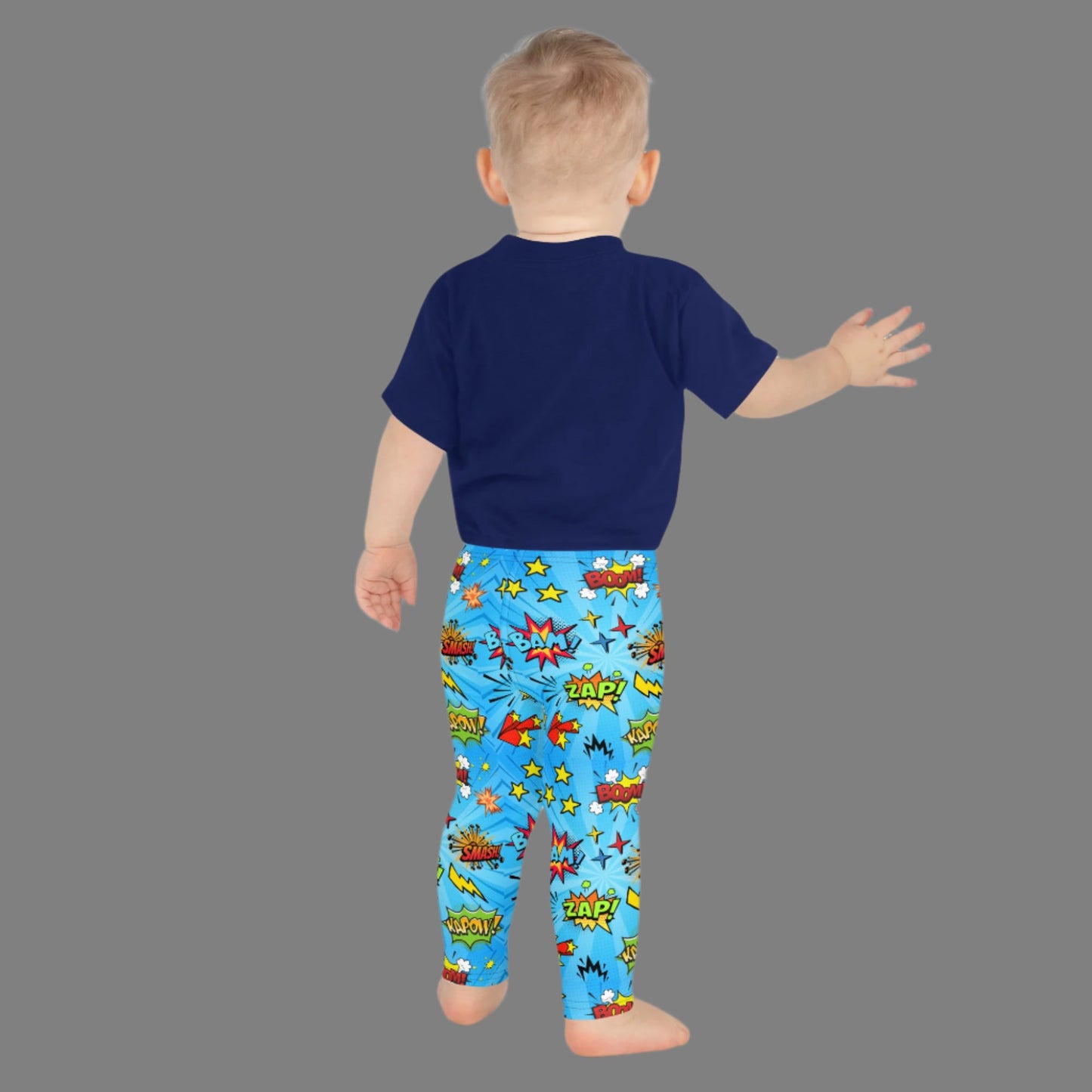 Blue leggings in size 2T-7, with superhero graphics, and phrases like: Bam, Smash, Zap, Kapow. Comic Book Toddler Leggings, Superhero Kids Pants, Comic Con Cosplay Tights, Birthday Party Gift for Boys or Girls, by jaecrece