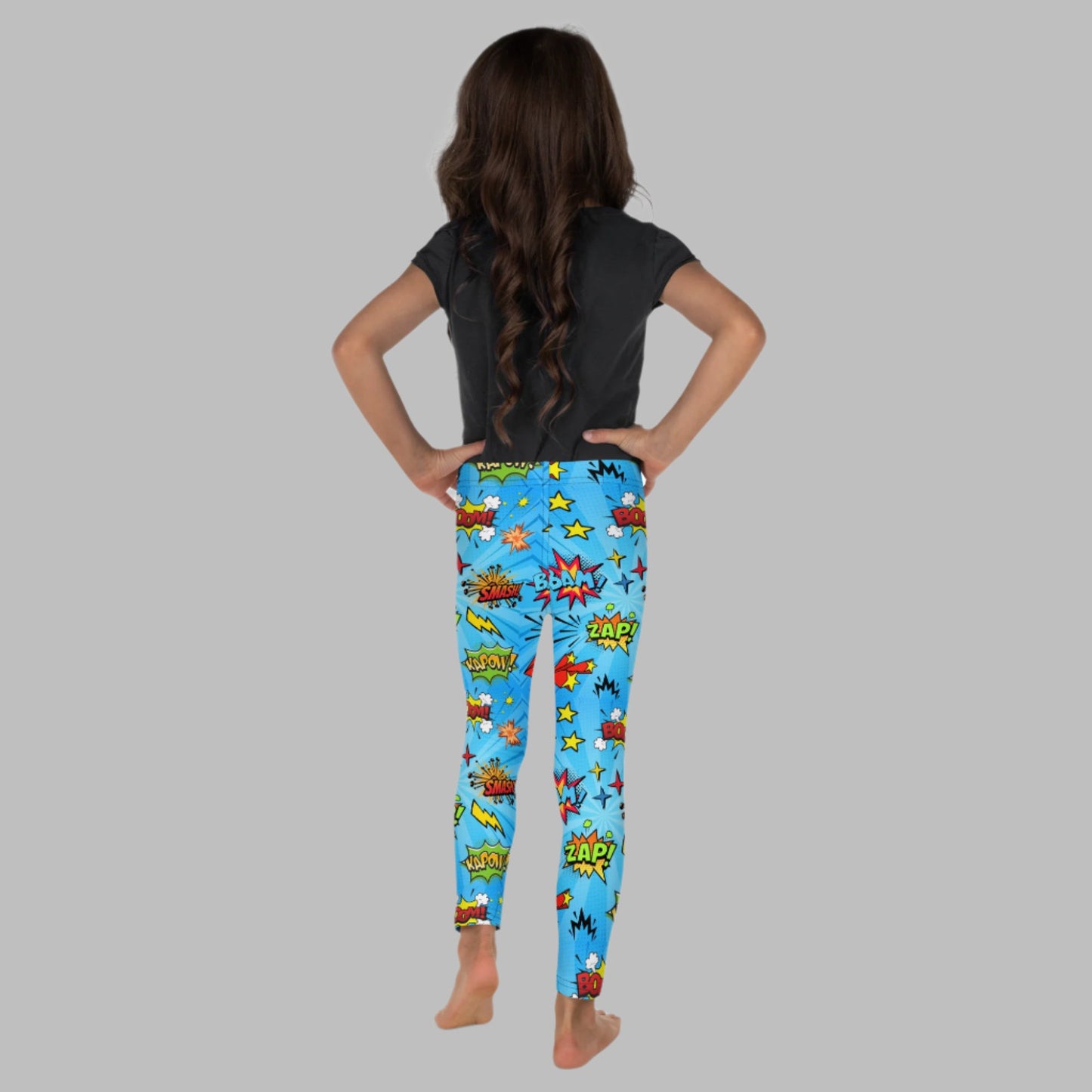 Blue leggings in size 2T-7, with superhero graphics, and phrases like: Bam, Smash, Zap, Kapow. Comic Book Toddler Leggings, Superhero Kids Pants, Comic Con Cosplay Tights, Birthday Party Gift for Boys or Girls, by jaecrece