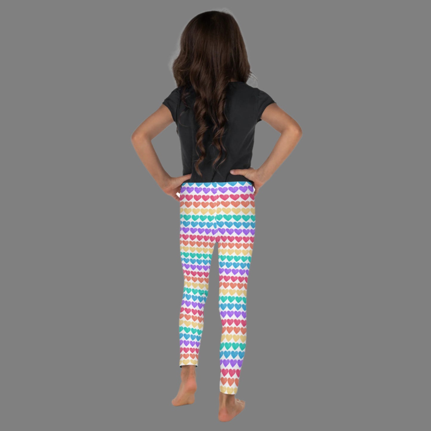 These rainbow heart toddler leggings are a playful and stylish staple, crafted from soft microfiber with four-way stretch. Designed in toddler sizes 2T–7, they feature bright heart stripes in all the colors of the rainbow, making them ideal for family pride outfits, festivals, or imaginative dress-up days.