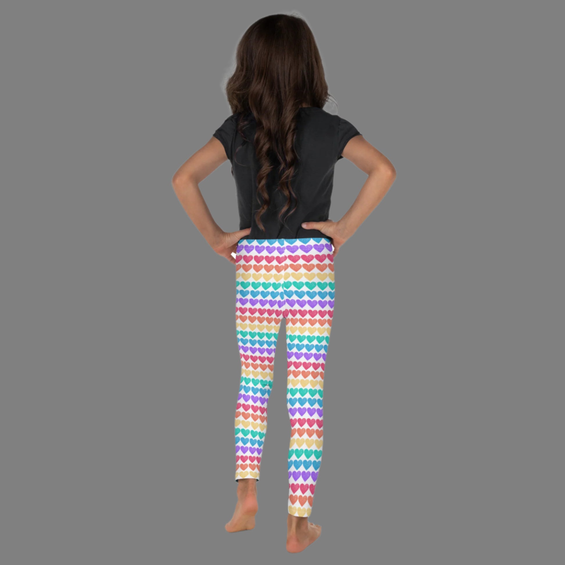 These rainbow heart toddler leggings are a playful and stylish staple, crafted from soft microfiber with four-way stretch. Designed in toddler sizes 2T–7, they feature bright heart stripes in all the colors of the rainbow, making them ideal for family pride outfits, festivals, or imaginative dress-up days.