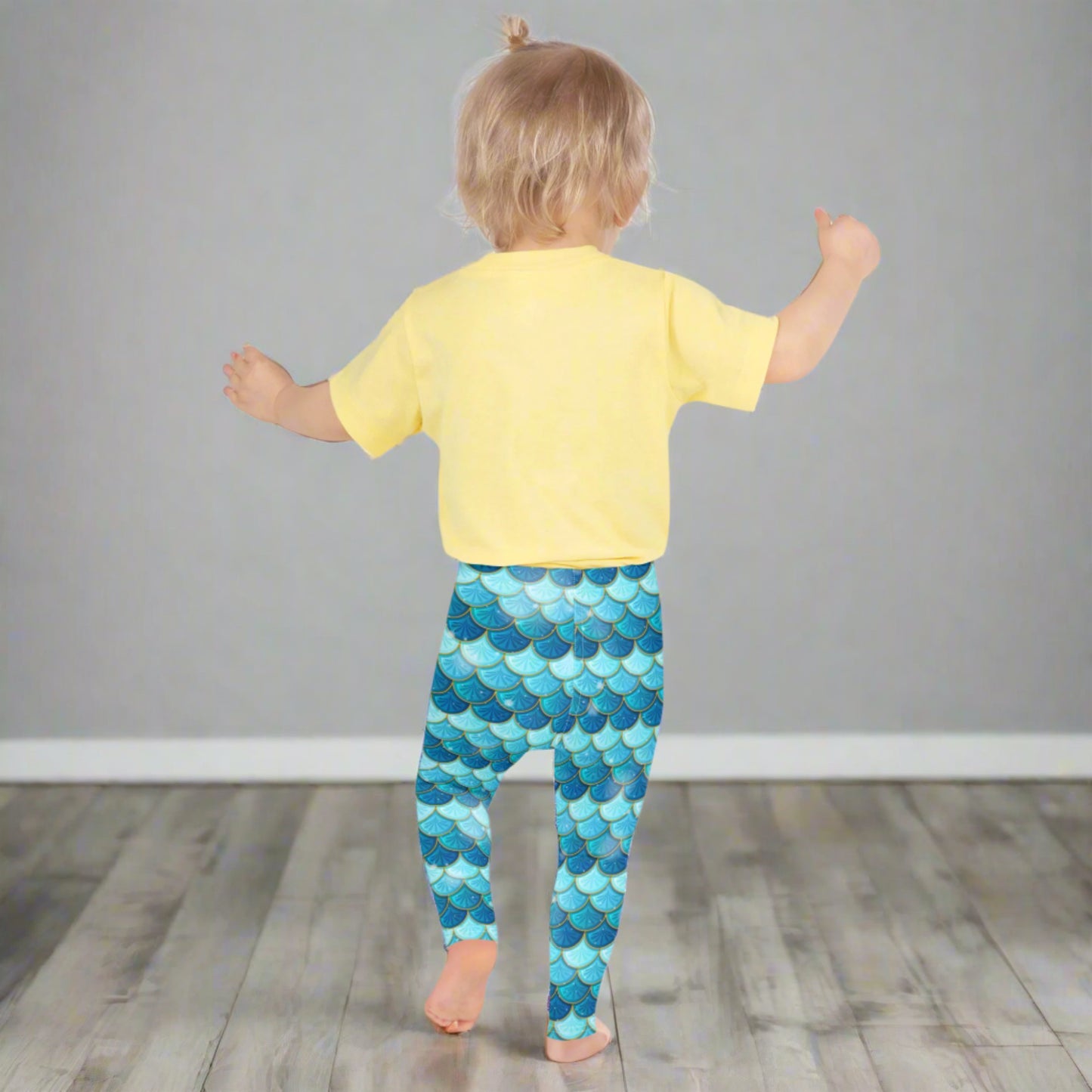 Image: Blue Mermaid Girls Leggings. These toddler yoga pants are mermaidcore aesthetic and available in sizes 2T-7. Perfect for mermaid themed birthday parties or Halloween costumes, by jaecrece