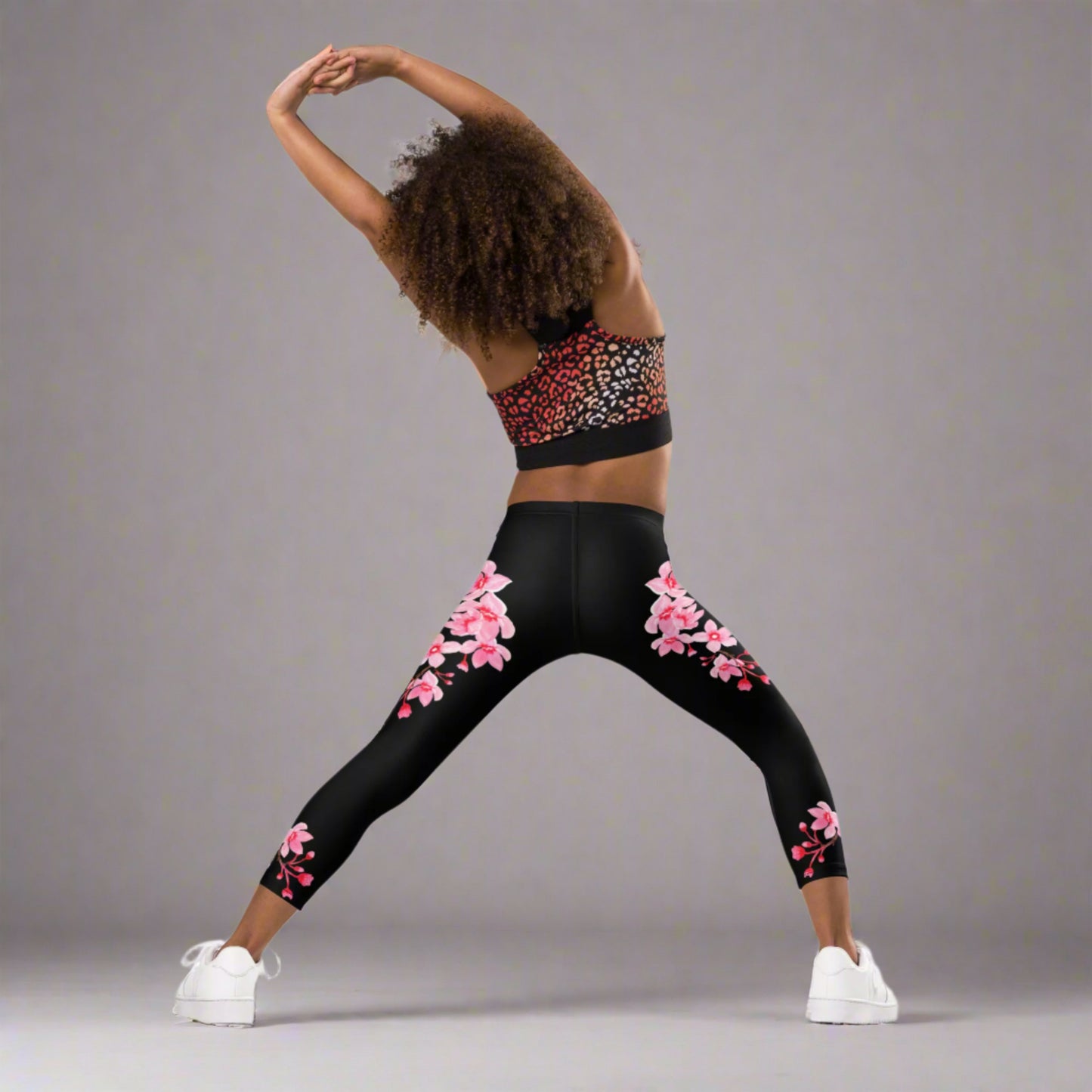 Image: Japanese Cherry Blossom Girls and Toddler Leggings, in sizes 2T, 3t, 4T, 5T, 6, 6X and 7. Black leggings with a swirl of Japanese cherry blossoms going down the outside of each leg. Elastic, soft, and durable with vibrant colors. Part of a matching collection for younger children and women, each pair is precision-cut and hand-sewn for a perfect fit.