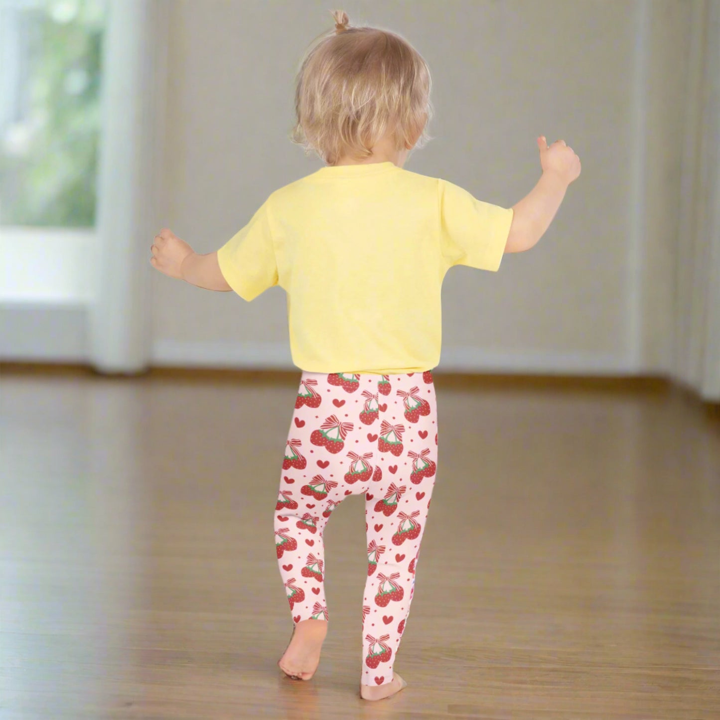 Image: Red bows and happy strawberries cover these pink leggings, designed for toddlers and girls who love to dress with a little sparkle. Available in sizes 2T through 7, they’re great for twirling, storytelling, and all kinds of fun. Soft and stretchy, they offer comfort for busy play days and charm for every outfit. A lovely gift for sweet little fashion lovers, by jaecrece.