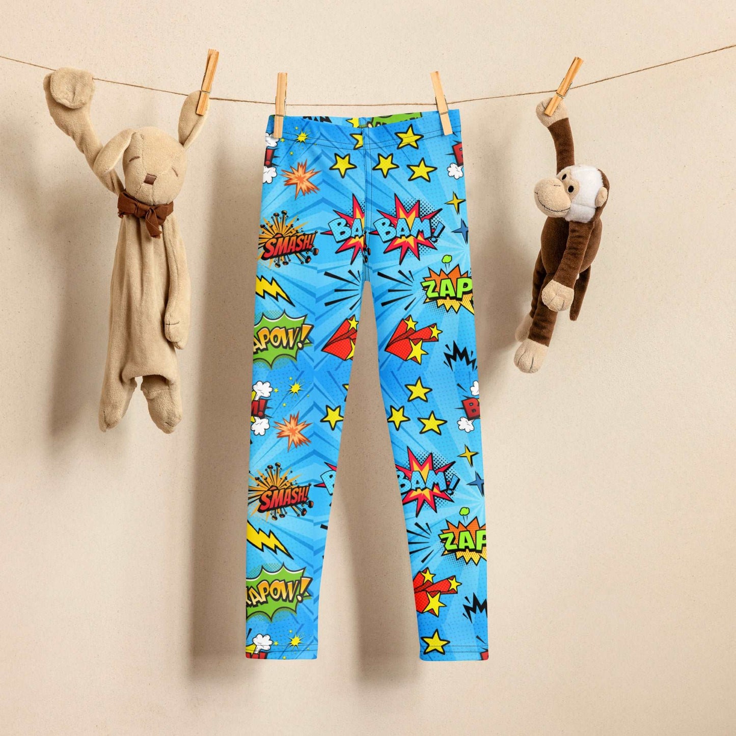 Blue leggings in size 2T-7, with superhero graphics, and phrases like: Bam, Smash, Zap, Kapow. Comic Book Toddler Leggings, Superhero Kids Pants, Comic Con Cosplay Tights, Birthday Party Gift for Boys or Girls, by jaecrece