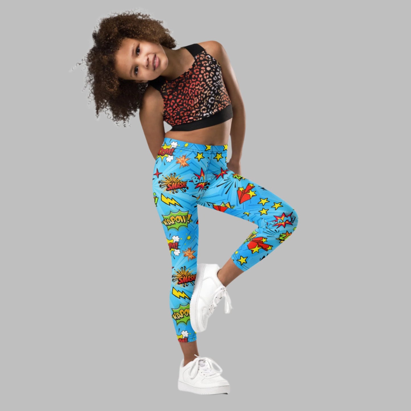 Blue leggings in size 2T-7, with superhero graphics, and phrases like: Bam, Smash, Zap, Kapow. Comic Book Toddler Leggings, Superhero Kids Pants, Comic Con Cosplay Tights, Birthday Party Gift for Boys or Girls, by jaecrece