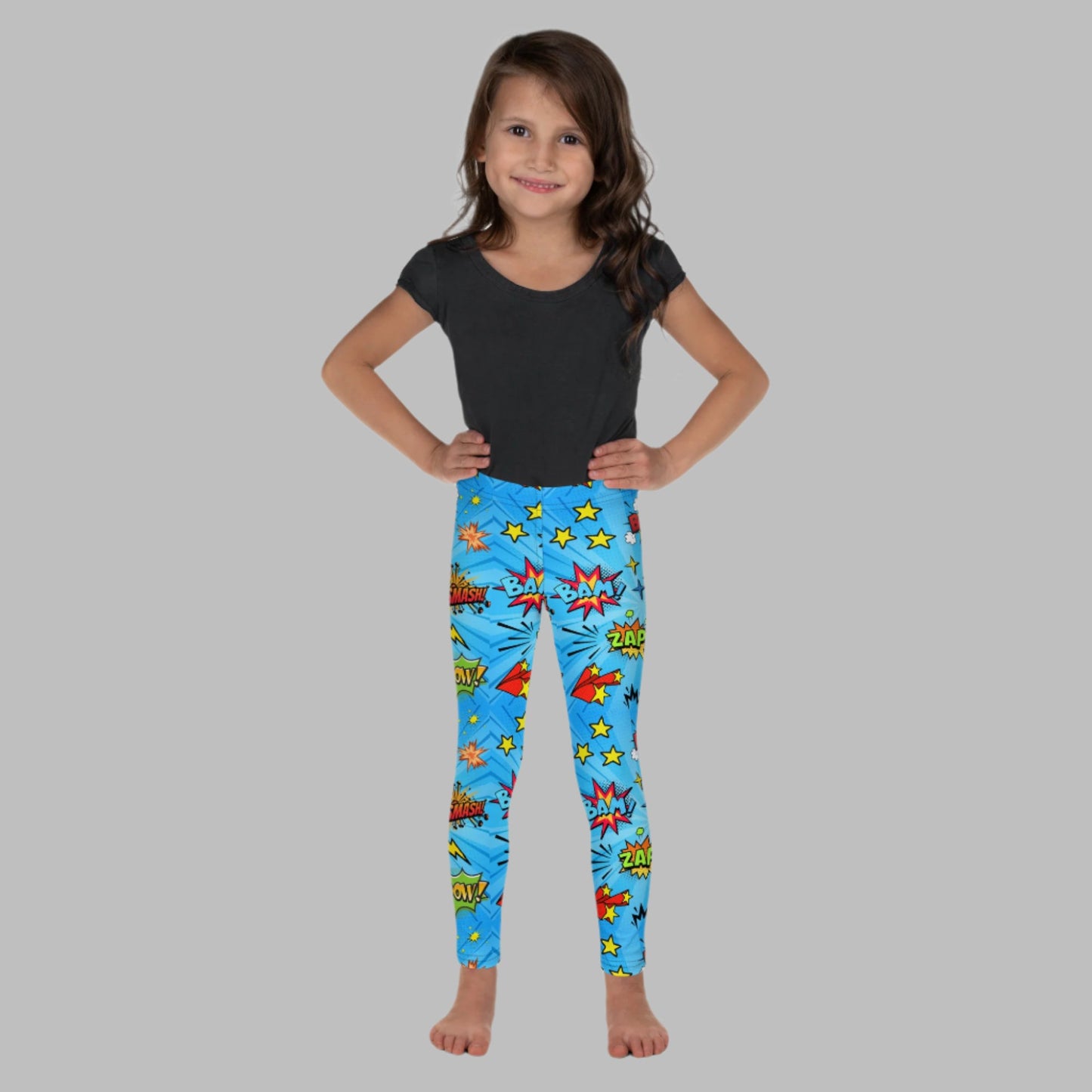 Blue leggings in size 2T-7, with superhero graphics, and phrases like: Bam, Smash, Zap, Kapow. Comic Book Toddler Leggings, Superhero Kids Pants, Comic Con Cosplay Tights, Birthday Party Gift for Boys or Girls, by jaecrece