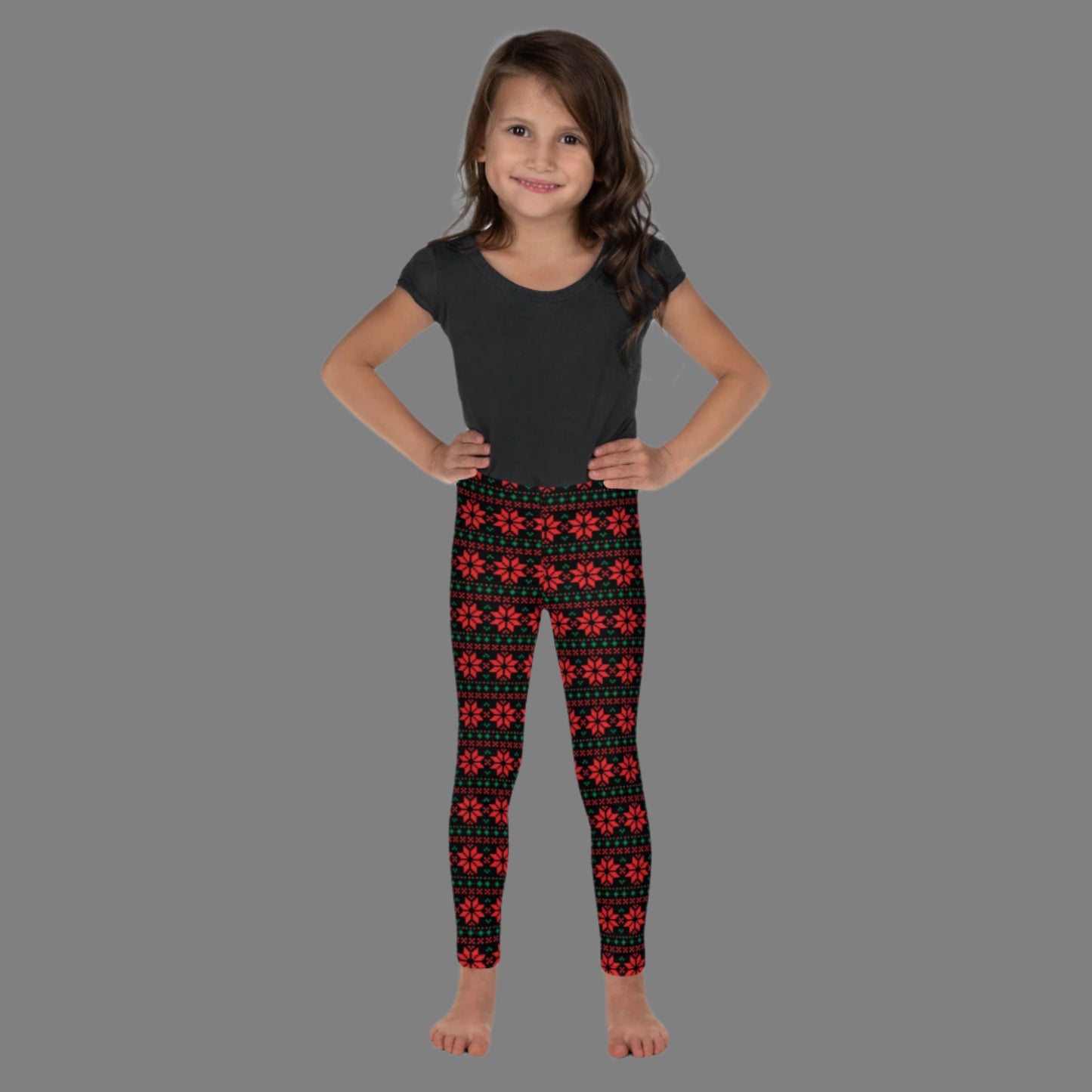 Christmas Poinsettia Toddler Leggings. Size 2T-7. Black leggings with an ugly sweater red and green poinsettia holiday pattern, by jaecrece