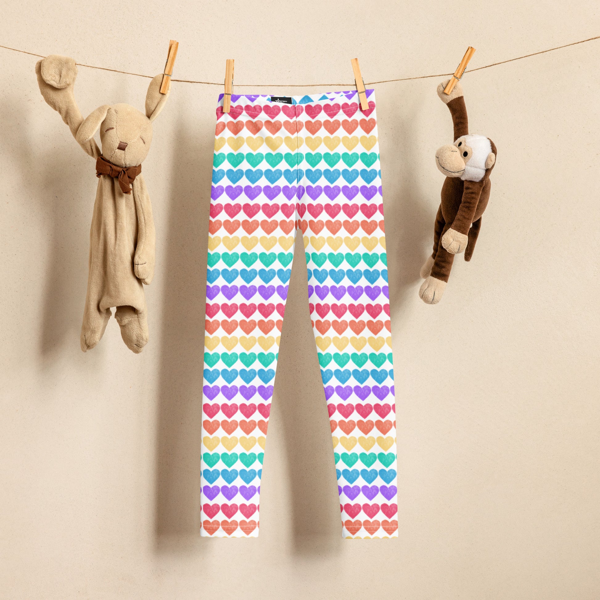 These Rainbow Hearts Toddler Leggings in sizes 2T–7 are bright, stretchy, and perfect for your little one’s bold adventures. Featuring rows of rainbow-colored hearts and a comfy elastic waistband, these full-length leggings are ideal for Pride, playdates, parades, and parties. Made with soft microfiber and four-way stretch, they’re durable for all-day fun. Match them with youth and women’s sizes for a colorful family look.