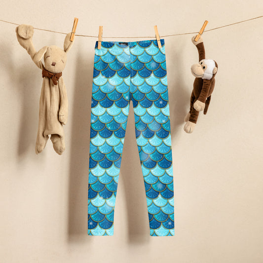 Image: Blue Mermaid Girls Leggings. These toddler yoga pants are mermaidcore aesthetic and available in sizes 2T-7. Perfect for mermaid themed birthday parties or Halloween costumes, by jaecrece