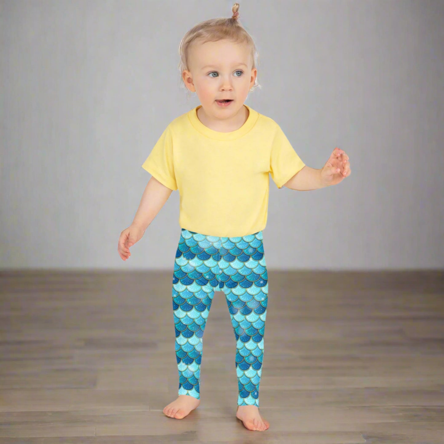 Image: Blue Mermaid Girls Leggings. These toddler yoga pants are mermaidcore aesthetic and available in sizes 2T-7. Perfect for mermaid themed birthday parties or Halloween costumes, by jaecrece