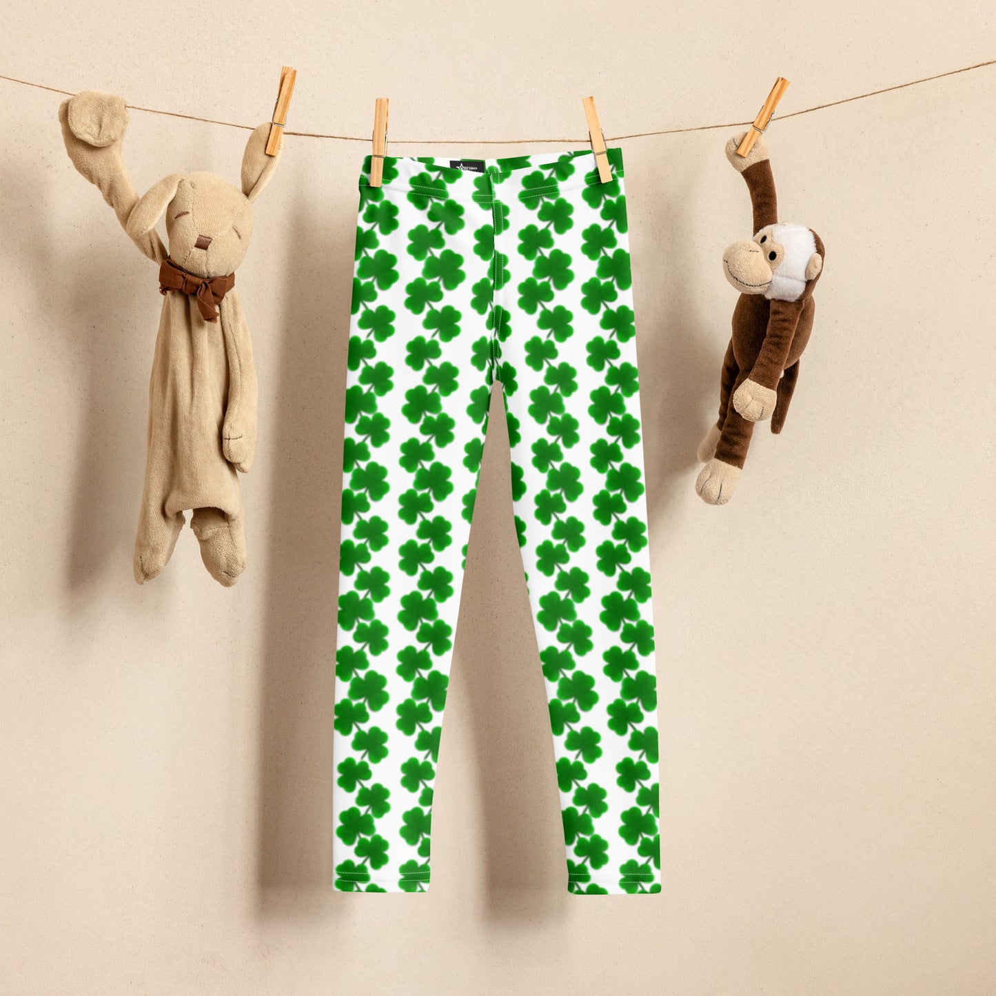 Image: St Patricks Day Leggings for toddlers and girls. Great white tights with a pattern of four leaf covers repeating down each leg. Also available in tween girl and womens sizes for family matching outfits, by jaecrece
