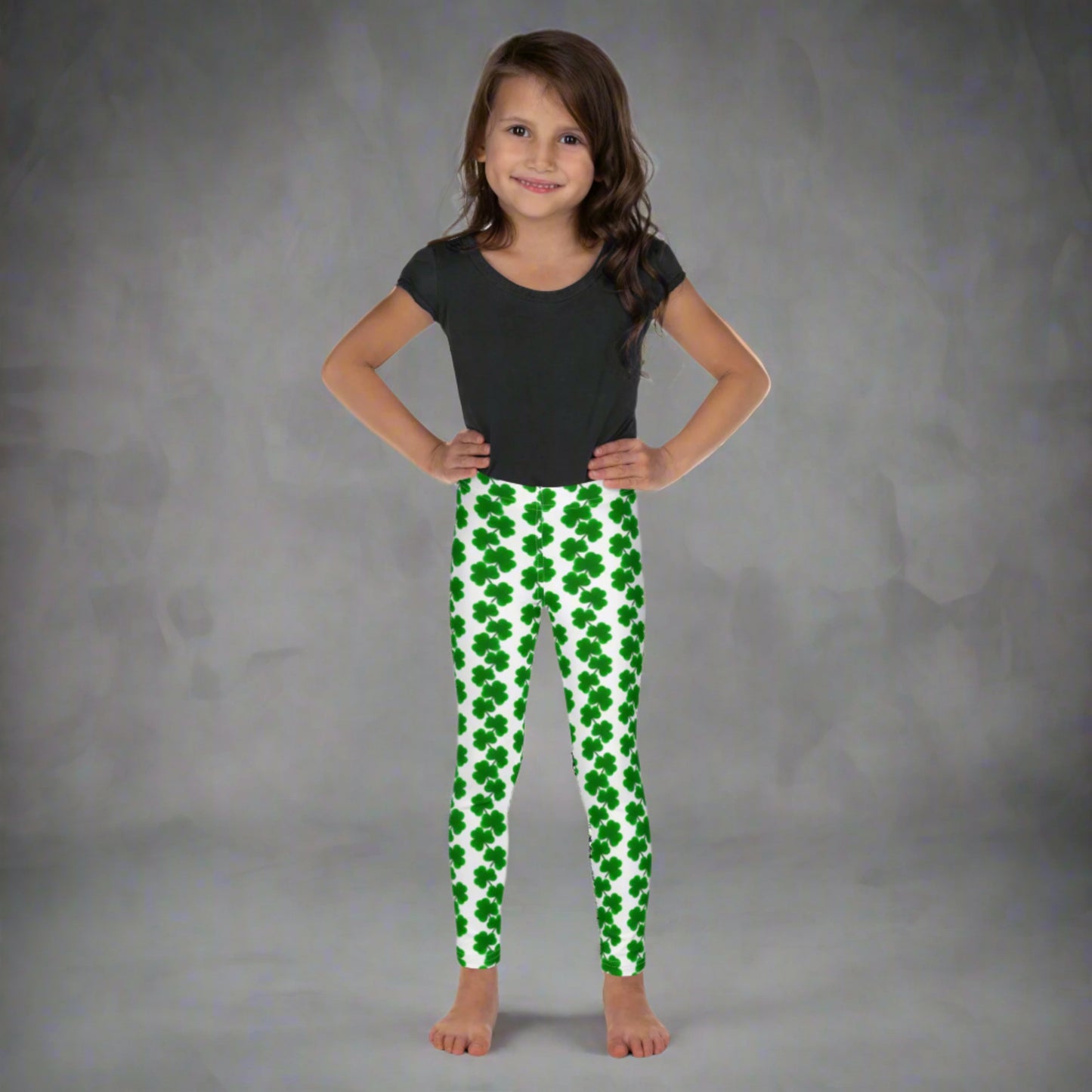 Image: St Patricks Day Leggings for toddlers and girls. Great white tights with a pattern of four leaf covers repeating down each leg. Also available in tween girl and womens sizes for family matching outfits, by jaecrece
