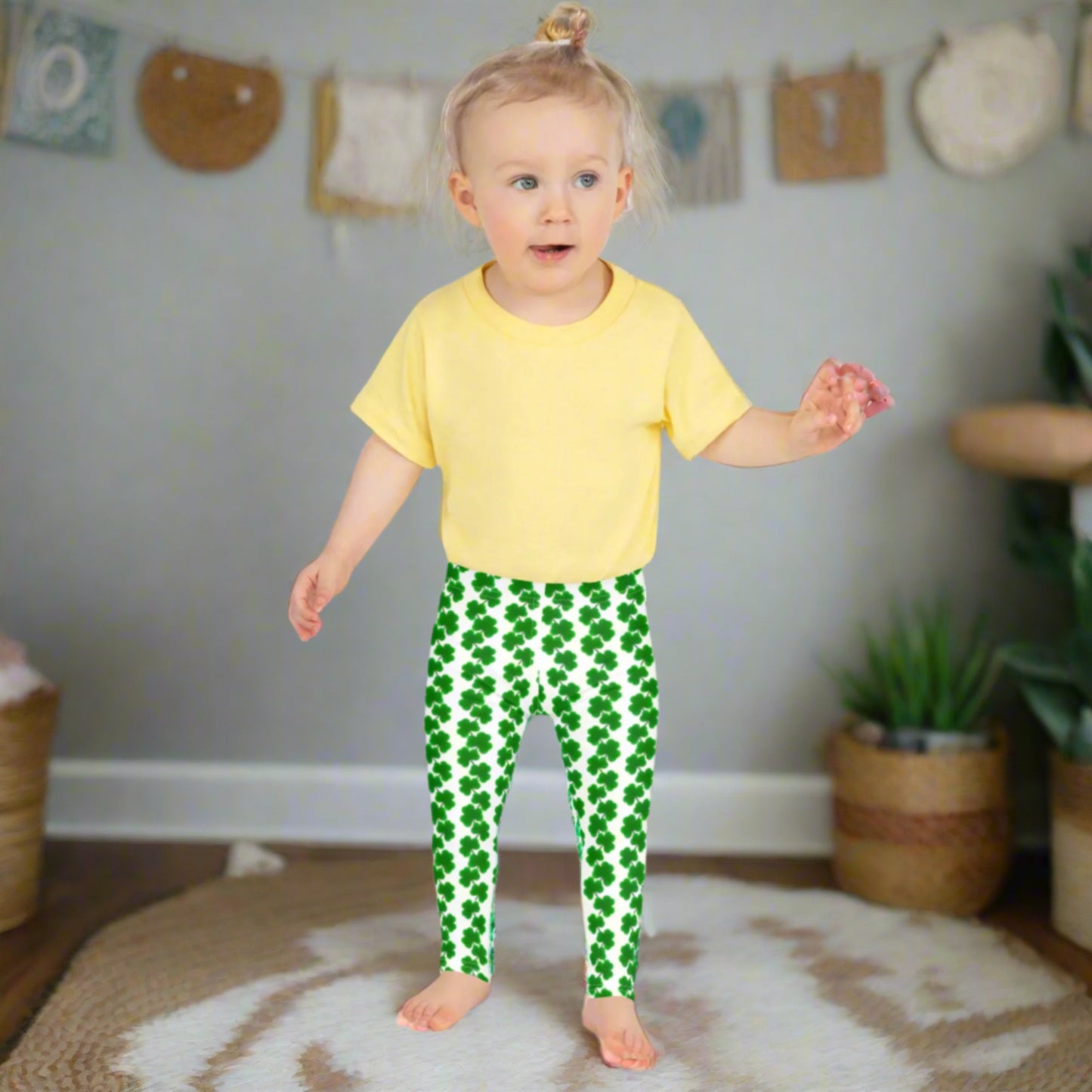 Image: St Patricks Day Leggings for toddlers and girls. Great white tights with a pattern of four leaf covers repeating down each leg. Also available in tween girl and womens sizes for family matching outfits, by jaecrece