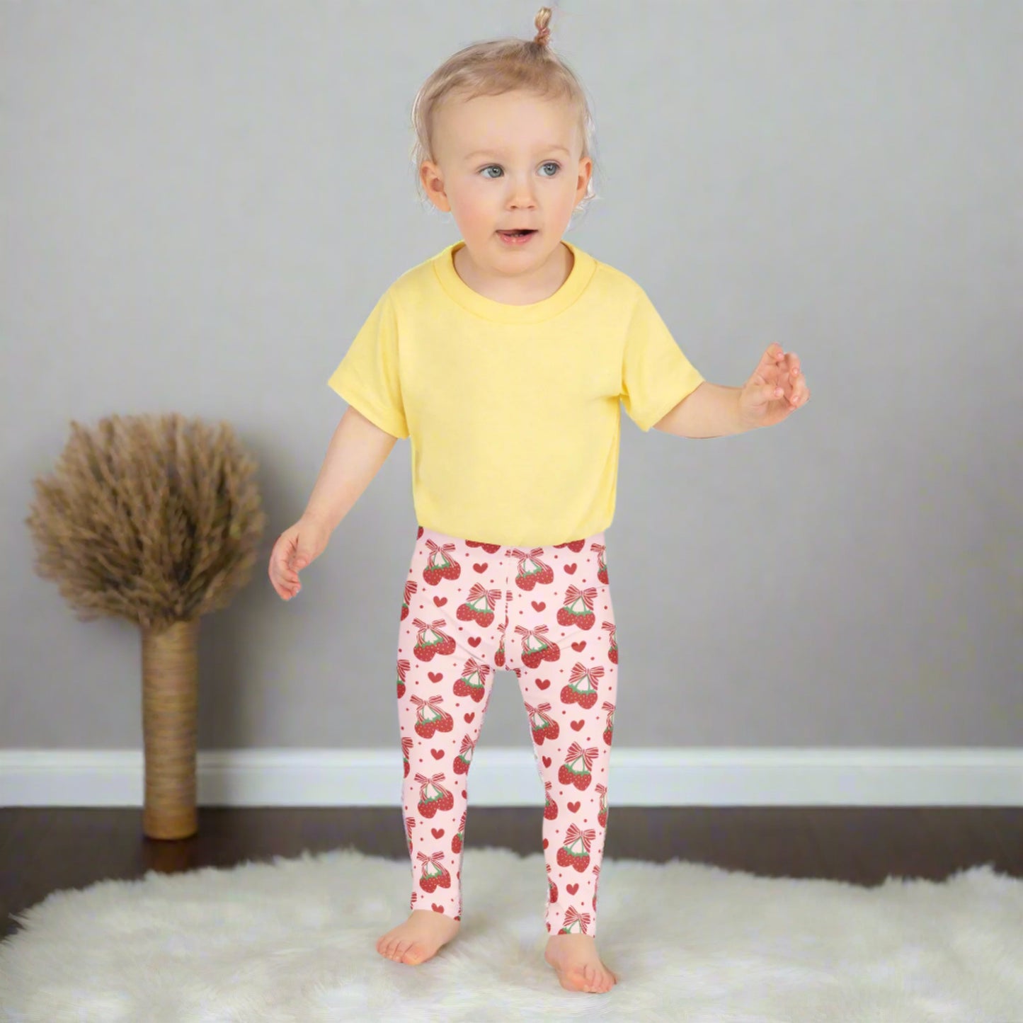 Image: Red bows and happy strawberries cover these pink leggings, designed for toddlers and girls who love to dress with a little sparkle. Available in sizes 2T through 7, they’re great for twirling, storytelling, and all kinds of fun. Soft and stretchy, they offer comfort for busy play days and charm for every outfit. A lovely gift for sweet little fashion lovers, by jaecrece.