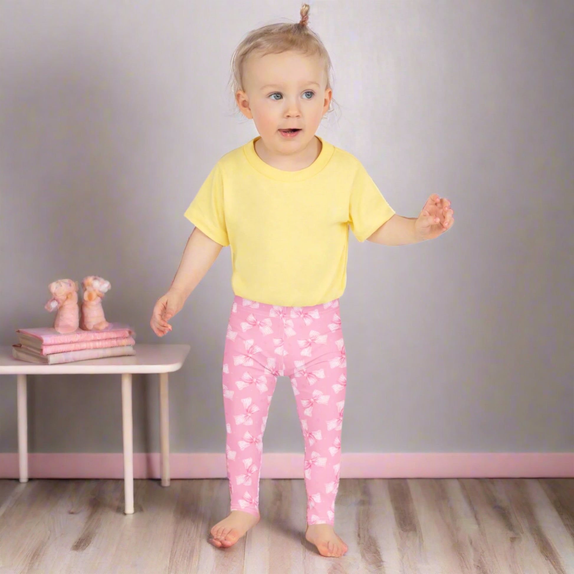 Image: Pink gingham bows decorate these coquette leggings made for toddlers and girls in sizes 2T to 7. Soft and flexible, they are perfect for your little one to wear during playdates, preschool, or special outings. The charming print and cozy feel make them a great gift for any stylish child, by jaecrece.