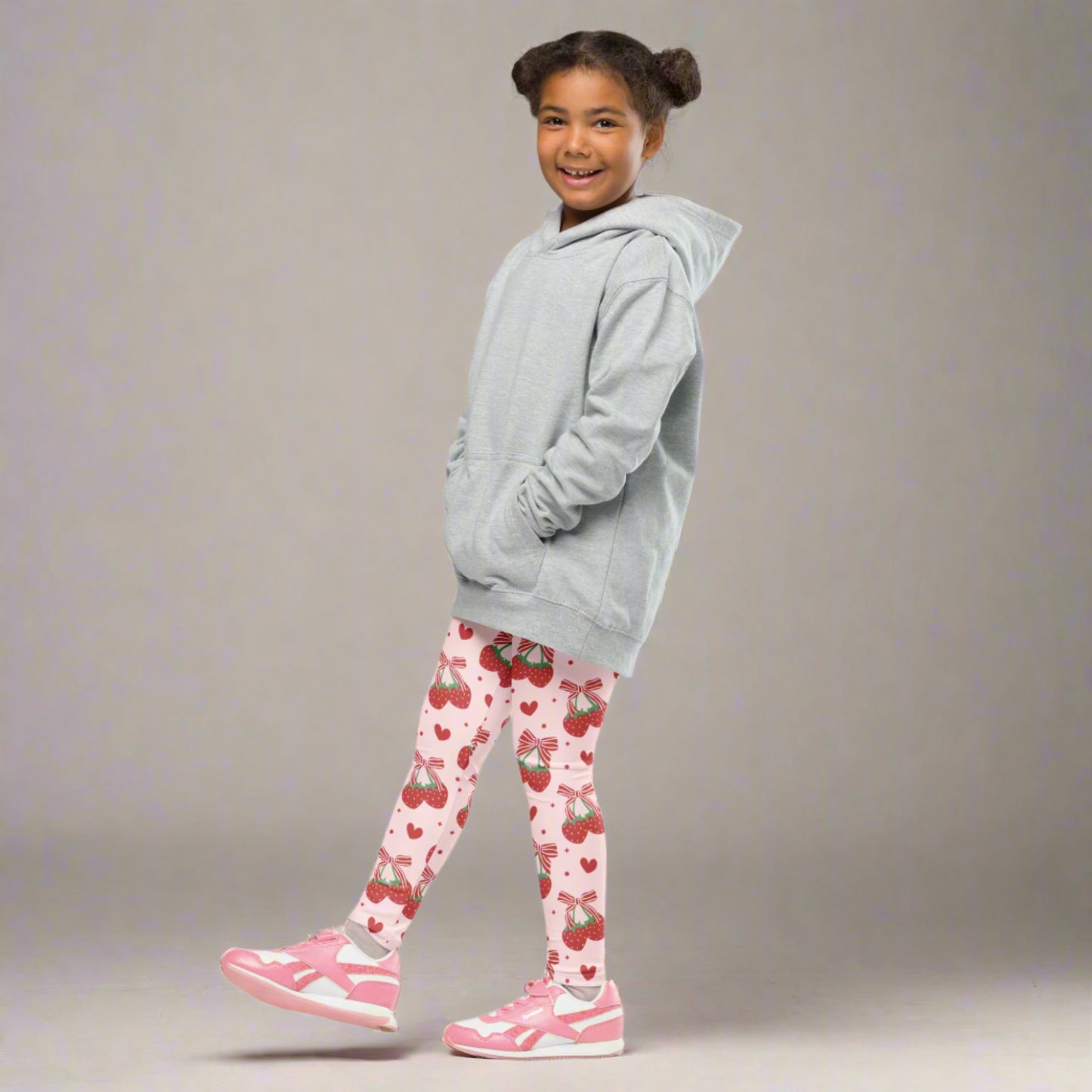 Image: Fun and full of flair, these leggings for toddlers and girls come in sizes 2T to 7 and feature an allover print of strawberries and bows. The pink background adds a soft, girly touch while the design keeps things fresh and cute. Great for daily wear, photo shoots, or birthday gifts, these leggings are a sweet treat for any little one’s closet, by jaecrece.