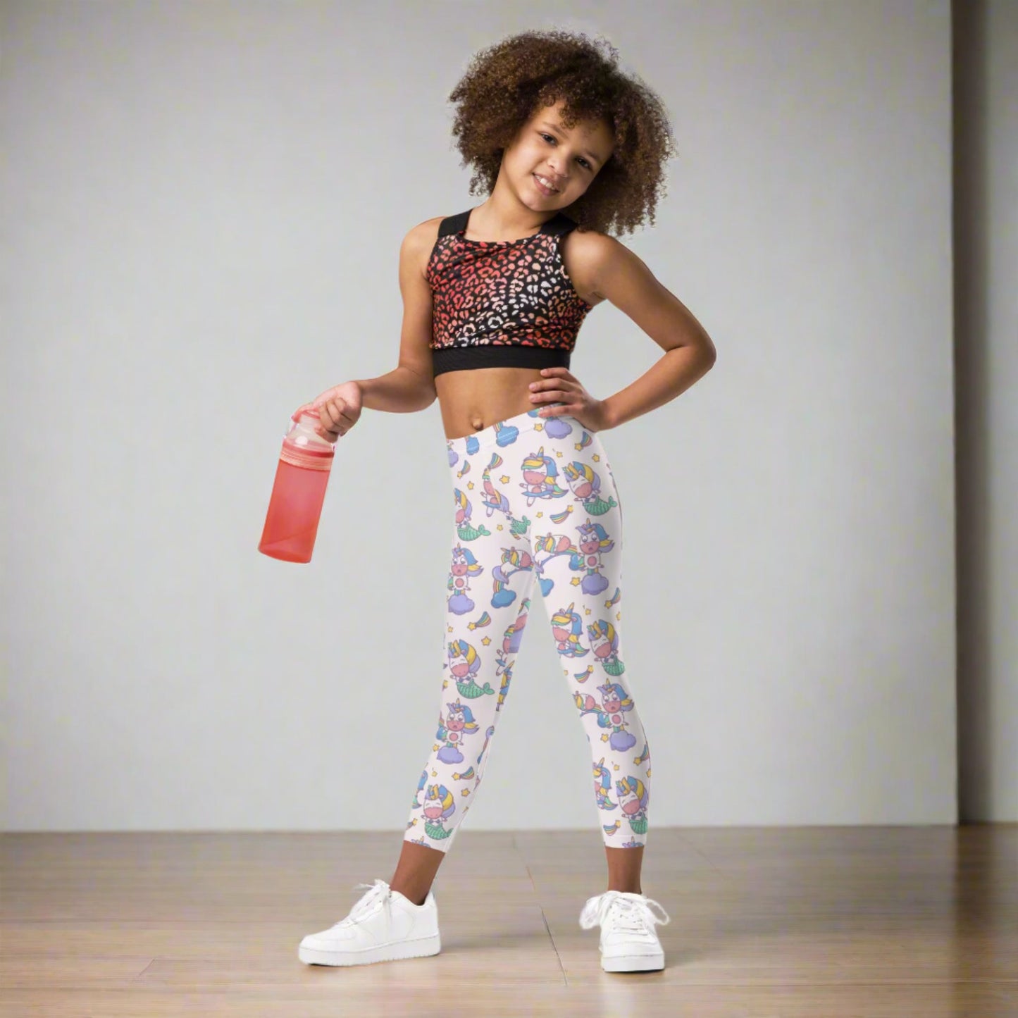 Image: Unicorn Mermaid Kawaii Girls Leggings. These pastel pink yoga pants feature a cute pattern graphic of Unicorn mermaids, stars and rainbows. The perfect birthday present, Christmas gift, school outfit for toddlers, tweens and teens, by jaecrece