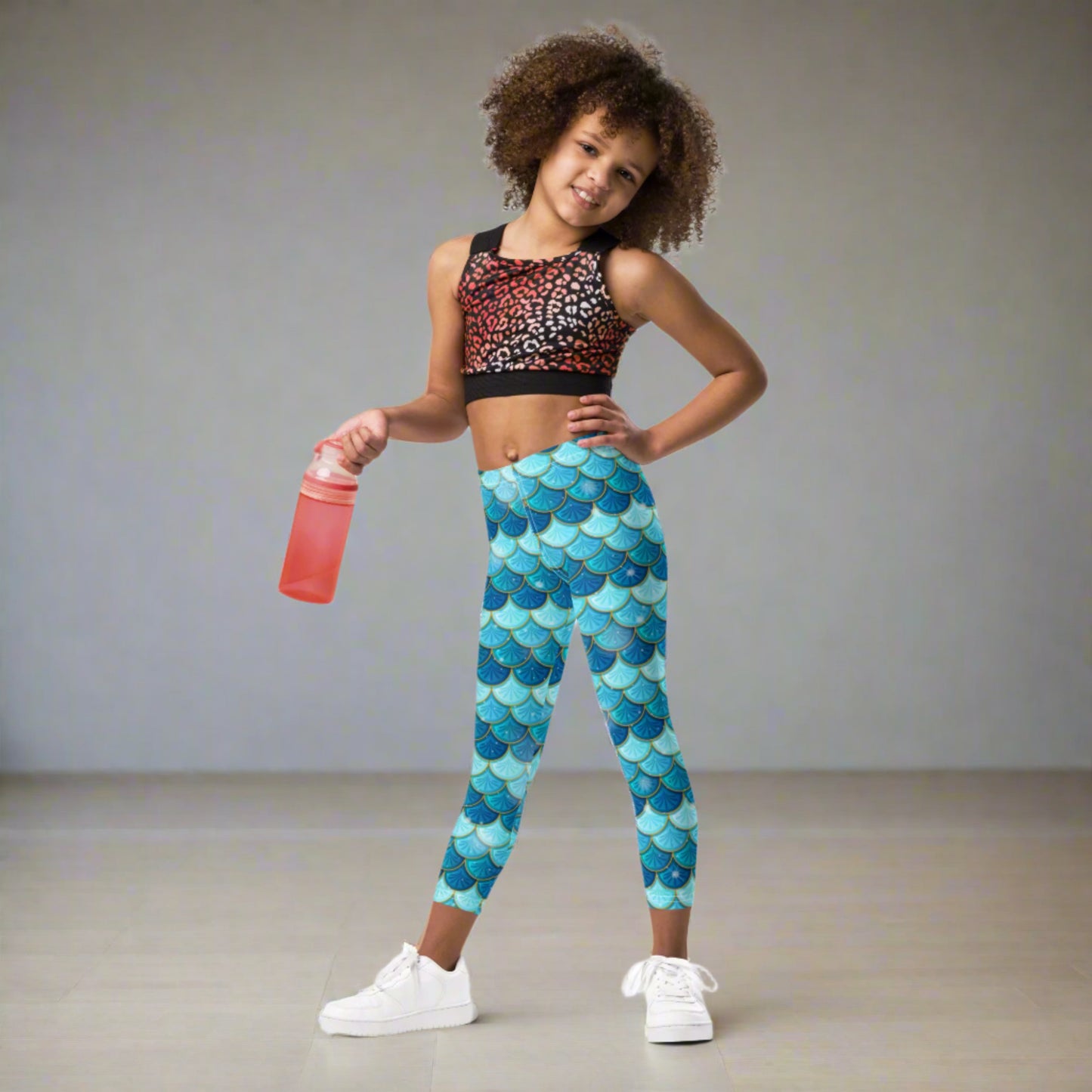 Image: Blue Mermaid Girls Leggings. These toddler yoga pants are mermaidcore aesthetic and available in sizes 2T-7. Perfect for mermaid themed birthday parties or Halloween costumes, by jaecrece