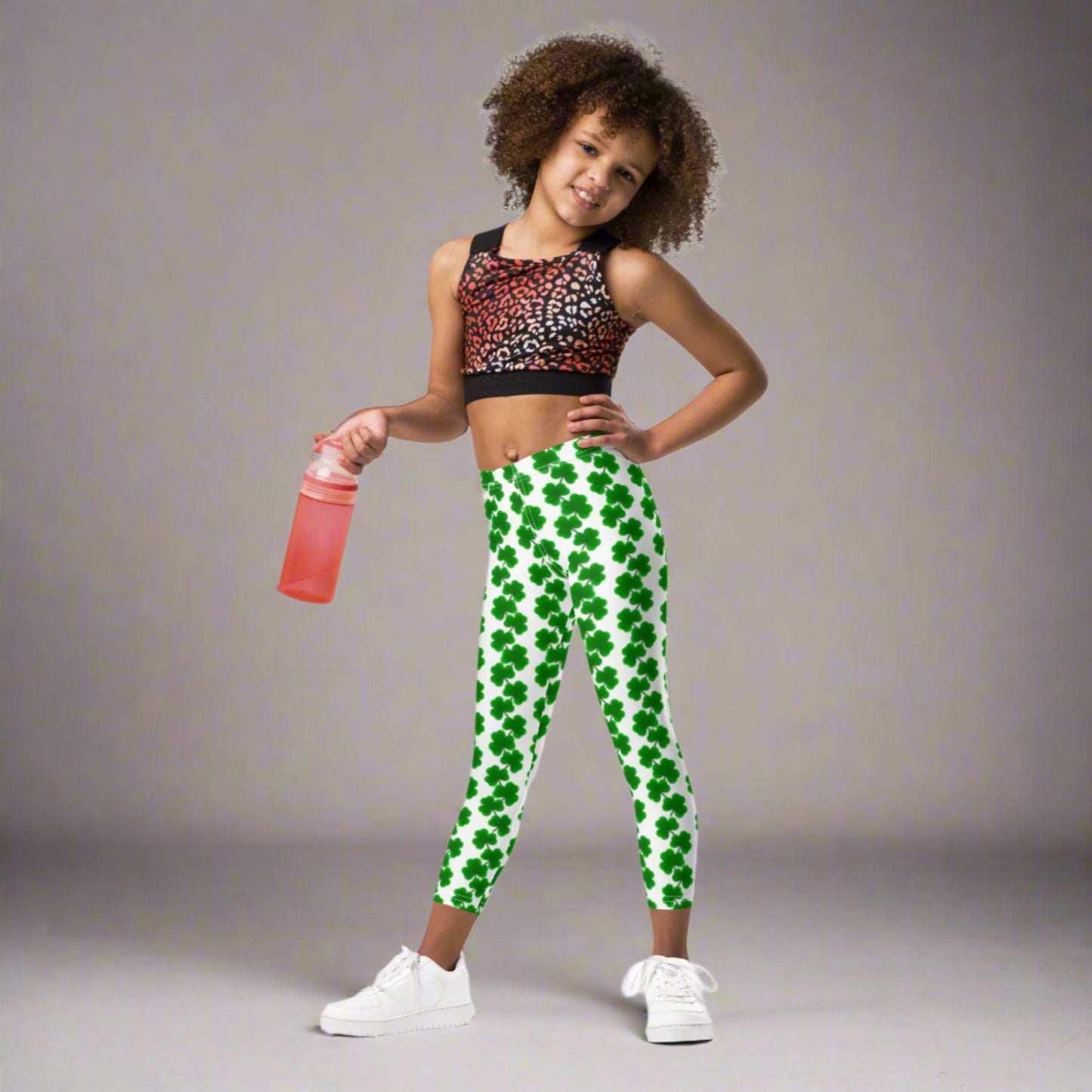 Image: St Patricks Day Leggings for toddlers and girls. Great white tights with a pattern of four leaf covers repeating down each leg. Also available in tween girl and womens sizes for family matching outfits, by jaecrece