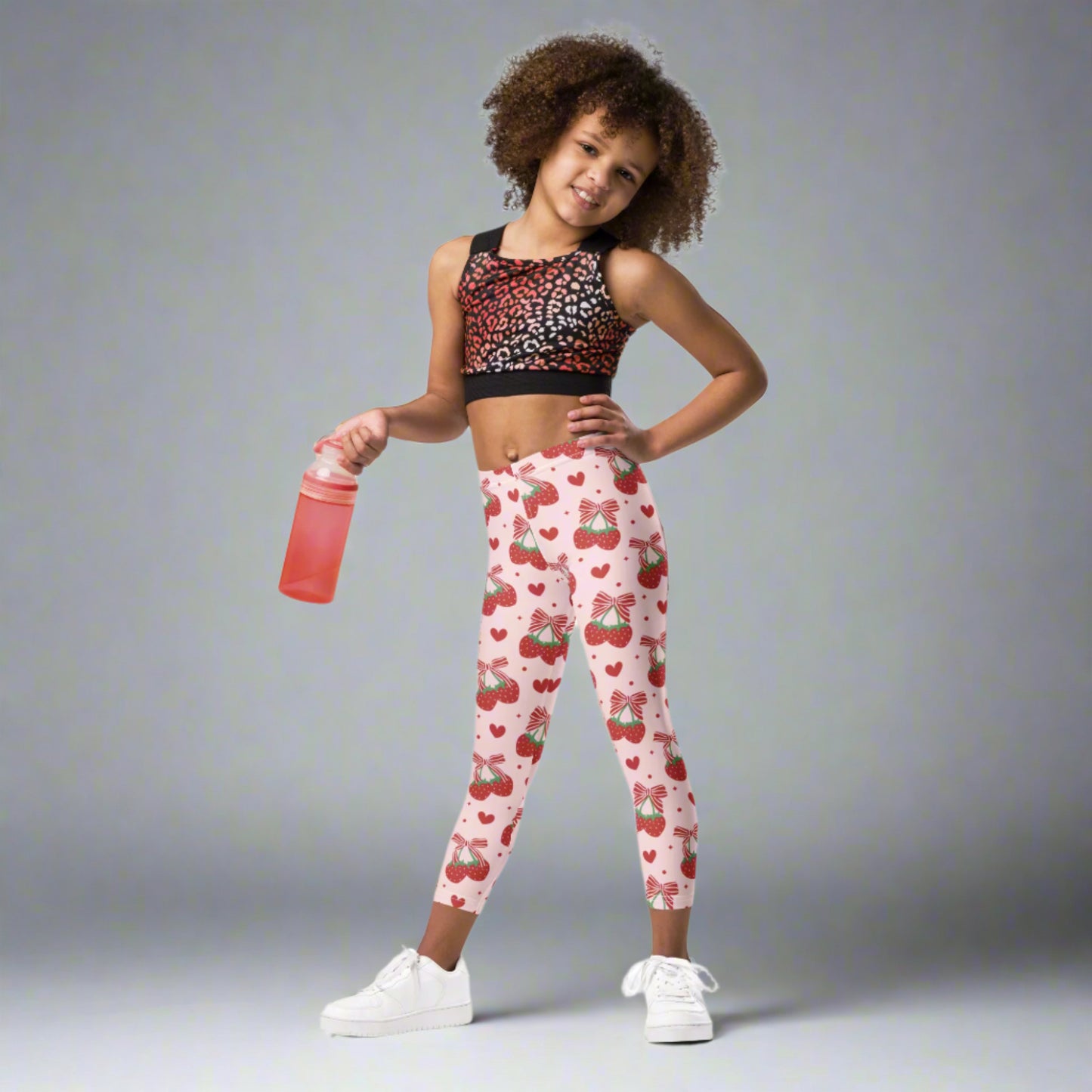 Image: Red bows and happy strawberries cover these pink leggings, designed for toddlers and girls who love to dress with a little sparkle. Available in sizes 2T through 7, they’re great for twirling, storytelling, and all kinds of fun. Soft and stretchy, they offer comfort for busy play days and charm for every outfit. A lovely gift for sweet little fashion lovers, by jaecrece.