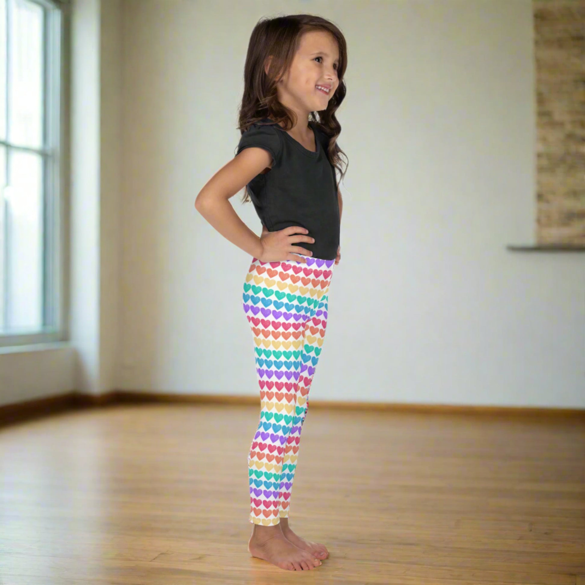 Add a burst of color to your toddler’s day with these rainbow heart print leggings in sizes 2T–7. These leggings feature a high-rise fit and all-over rainbow heart design, making them a bold, playful choice for everyday wear, festivals, or family celebrations. Crafted with smooth microfiber fabric, they offer lasting stretch and comfort, perfect for active little ones.
