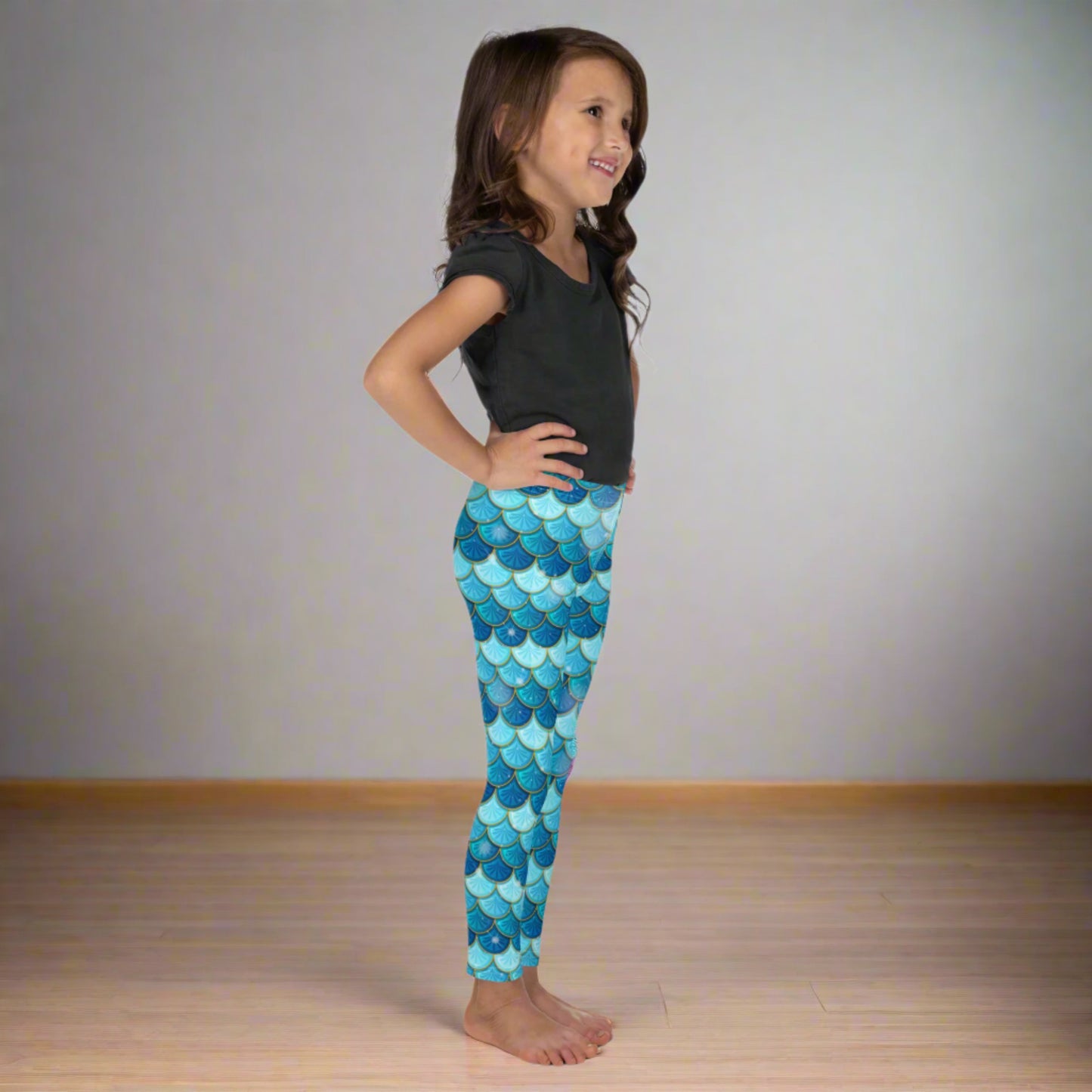 Image: Blue Mermaid Girls Leggings. These toddler yoga pants are mermaidcore aesthetic and available in sizes 2T-7. Perfect for mermaid themed birthday parties or Halloween costumes, by jaecrece