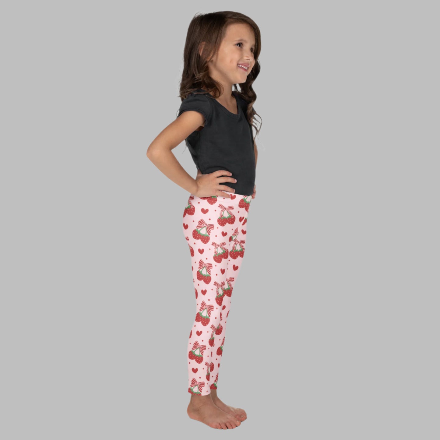 Image: With strawberries and ribbon bows all over, these toddler and girls leggings bring a sweet coquette vibe in playful pink. Available in sizes 2T to 7, they’re perfect for dress-up, playdates, or picture day. Comfortable and stretchy, they’re designed for all-day fun and giggles. An adorable choice for fashion-loving little ones or a special birthday surprise, by jaecrece.