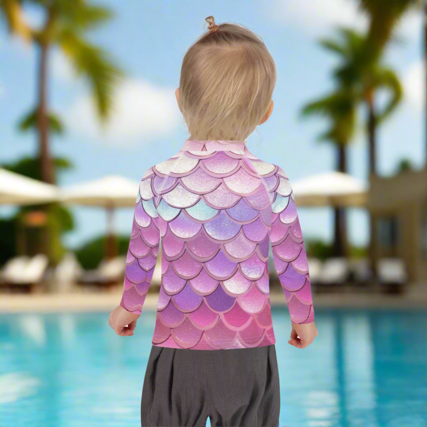 Image: Pink Mermaid Scales Girls rash guard. This swimwear is in toddler and girl sizes, and is part of a family matching swimwear collection. It features mermaid scales in shades of pink, blue and purple, by jaecrece