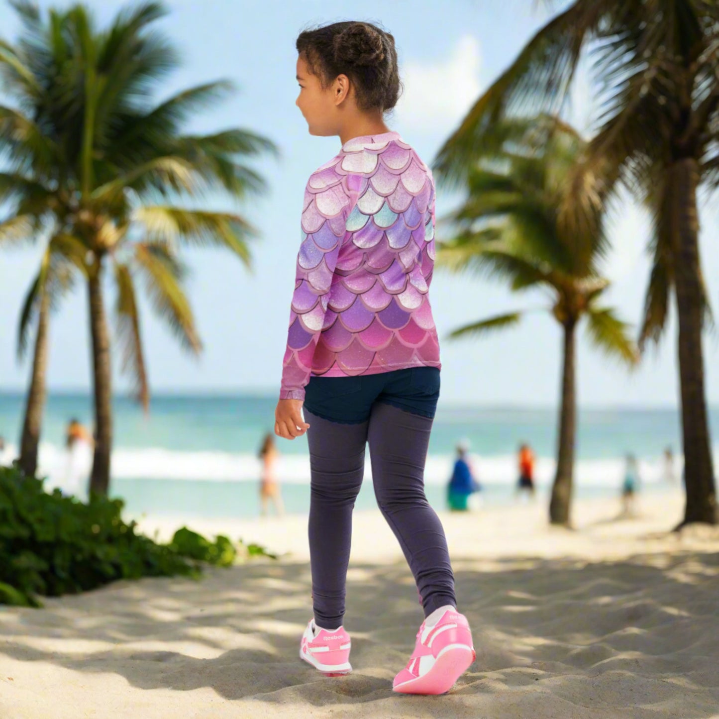 Image: Pink Mermaid Scales Girls rash guard. This swimwear is in toddler and girl sizes, and is part of a family matching swimwear collection. It features mermaid scales in shades of pink, blue and purple, by jaecrece