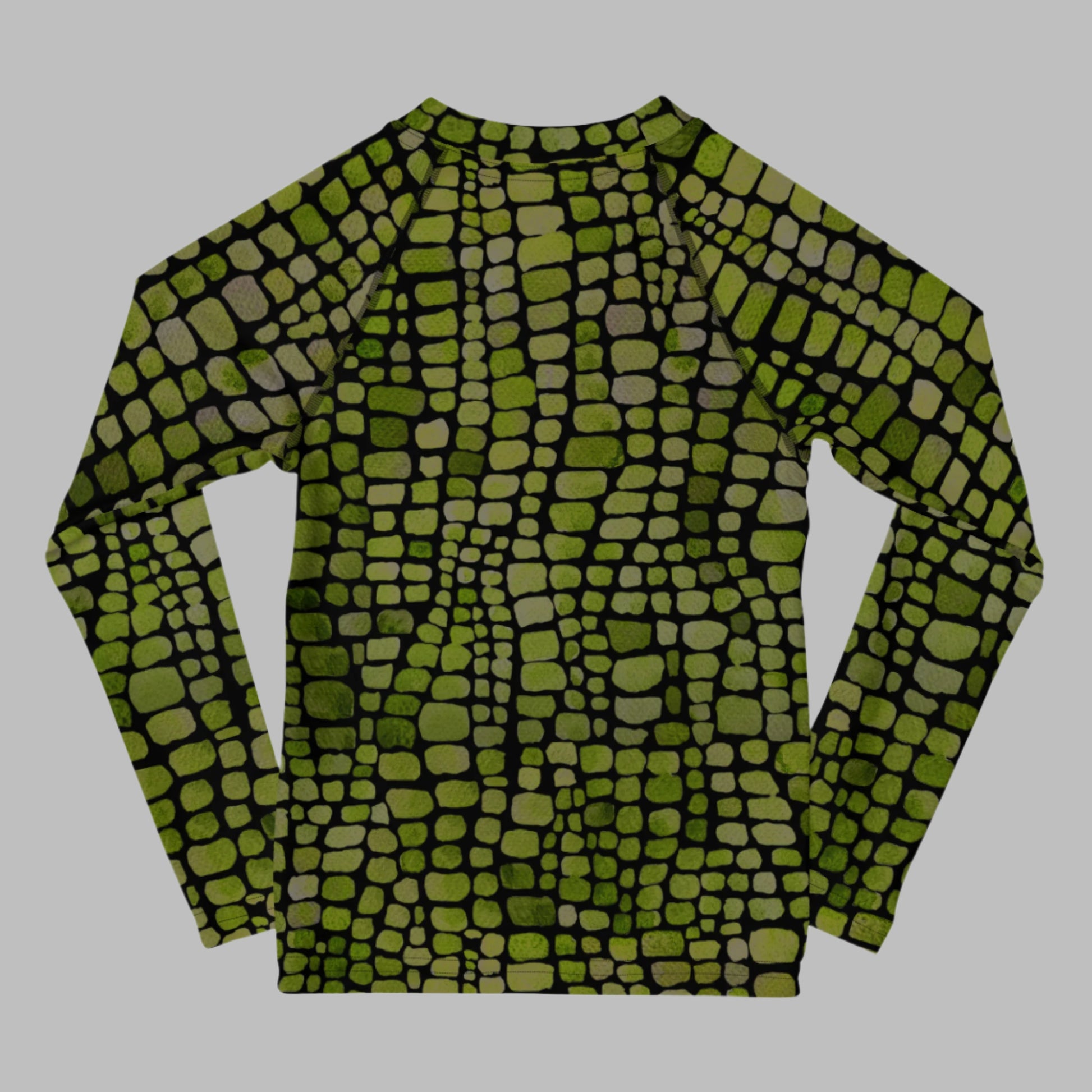 Reptile print toddler rash guard with UPF protection, featuring green scales for a fun and fierce look. This swim top is perfect for costumes, beach adventures, or outdoor play in sizes 2T–7. Designed for kids who love dinosaurs, lizards, or snakes, it’s a playful and practical piece for sun-safe summer days. Ideal for both boys and girls.