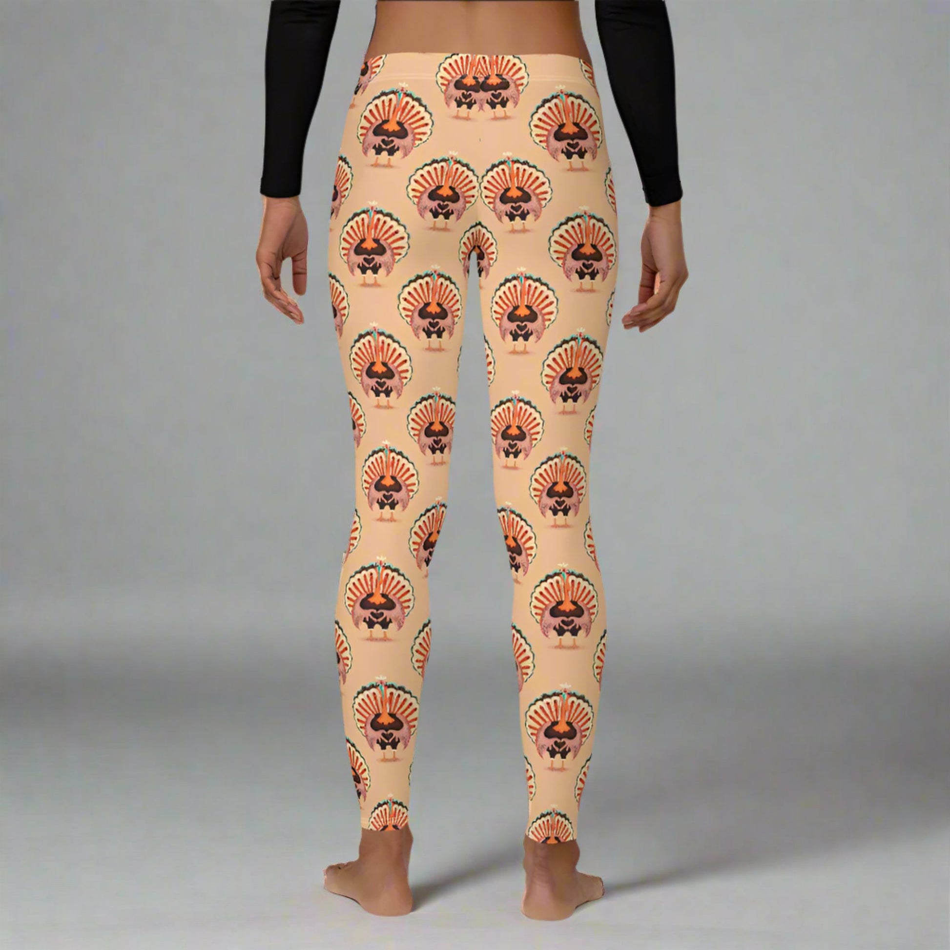 Thanksgiving Turkey Love ladies leggings. These womens yoga pants are peach, and have a repeating pattern of turkeys showing the love sign with their hands. These womens tights make a great gift, or a family matching outfit for the Turkey Trot! by jaecrece