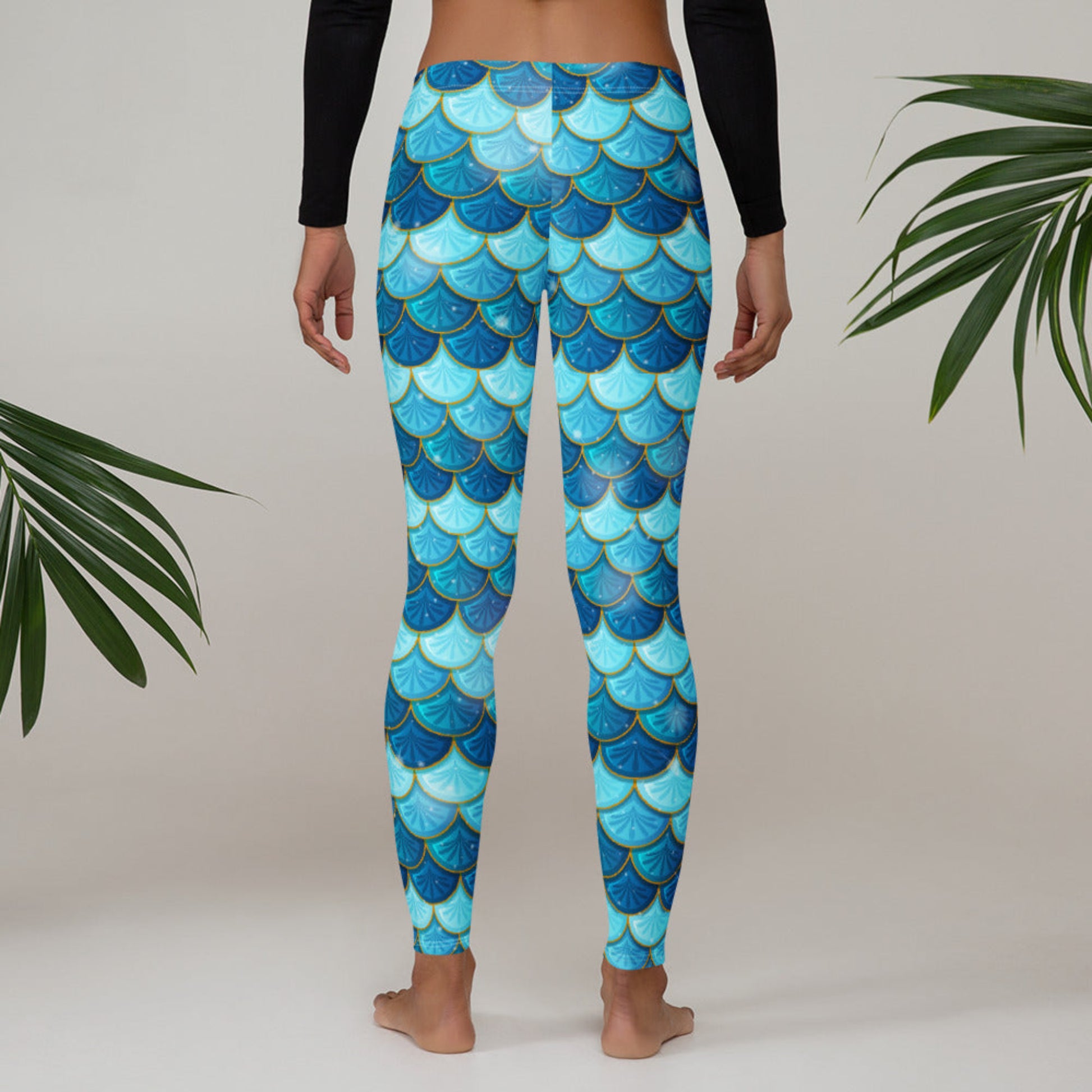 Image: Blue Mermaid Scales Leggings for Women. These mermaidcore aesthetic yoga pants have mermaid scales in shades of blue and teal with gold accents. Perfect for birthday parties, bachelorette parties, or Halloween mermaid costumes, by jaecrece