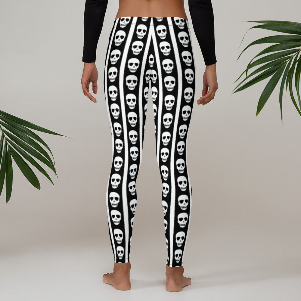 Image: Turn heads in these graphic leggings showcasing monochrome vertical stripes and skull motifs running along the legs. The slim fit and soft material make them perfect for yoga, lounging, or layering with a band tee. These leggings cater to fans of rocker chic, alternative aesthetics, and Halloween lovers alike, available in XS to XL for a versatile and bold wardrobe addition, by jaecrece.