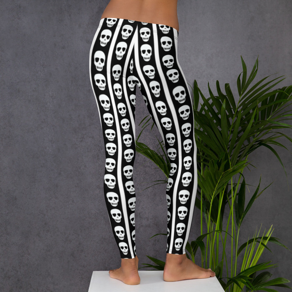 Image: For lovers of spooky flair and sharp design, these women’s leggings feature alternating black and white stripes with skulls lining the outer leg seams. The high contrast pattern draws the eye while providing a comfortable, stretchy fit. Whether worn to a Halloween event or as everyday alt fashion, these leggings come in sizes XS through XL and offer both comfort and drama, by jaecrece.