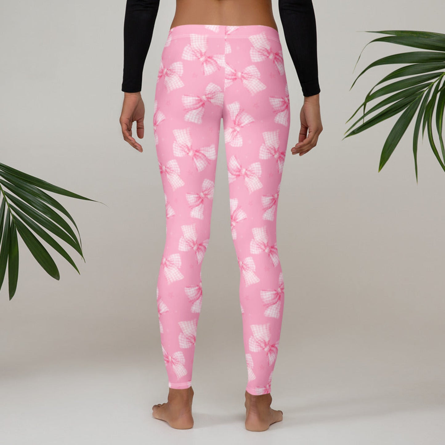 Image: Aesthetic pink leggings with a girly bow design for women. Sizes XS through XL available. Ideal for soft girl style, loungewear, and matching family sets. Feminine fashion meets all day comfort in this trending piece, great for birthdays, Valentine’s Day, or Mother’s Day, by jaecrece.