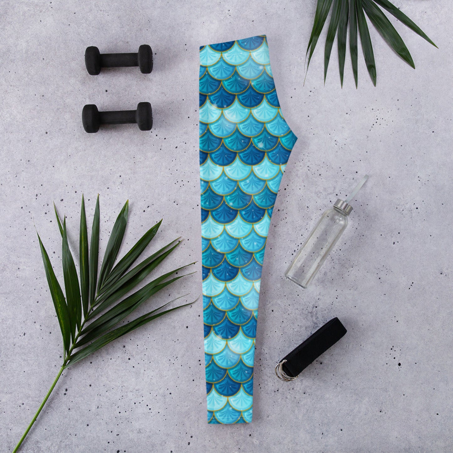Image: Blue Mermaid Scales Leggings for Women. These mermaidcore aesthetic yoga pants have mermaid scales in shades of blue and teal with gold accents. Perfect for birthday parties, bachelorette parties, or Halloween mermaid costumes, by jaecrece