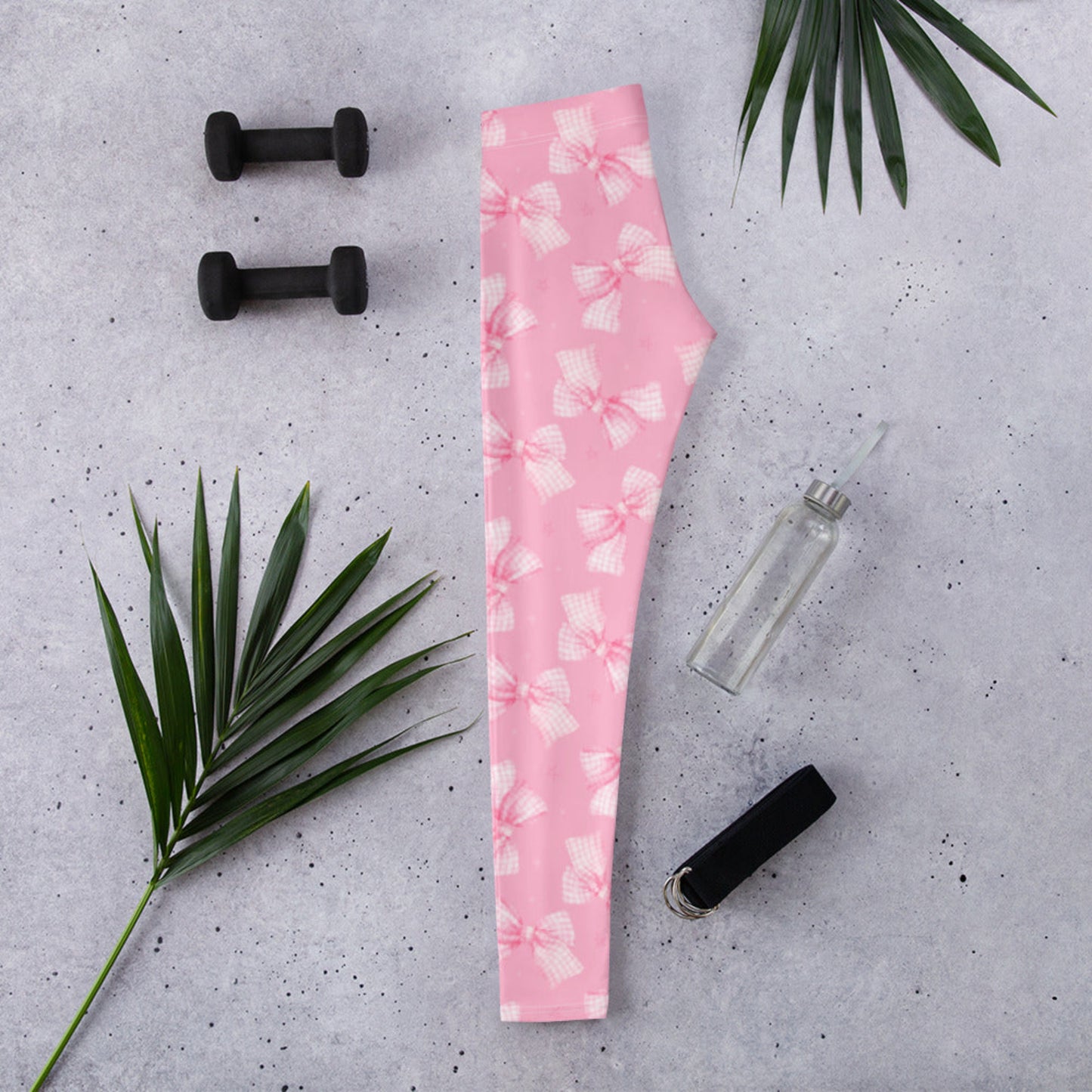 Image: Pink Bow Coquette Ladies Leggings for women shown on model wearing size small. These soft pink leggings feature an adorable bow pattern and are part of a matching collection with toddler and youth sizes. Ideal for women who love feminine style, girly outfits, or cottagecore fashion with a playful twist. Aesthetic loungewear perfect for spring, Valentine’s Day, or year-round cute comfort, by jaecrece.