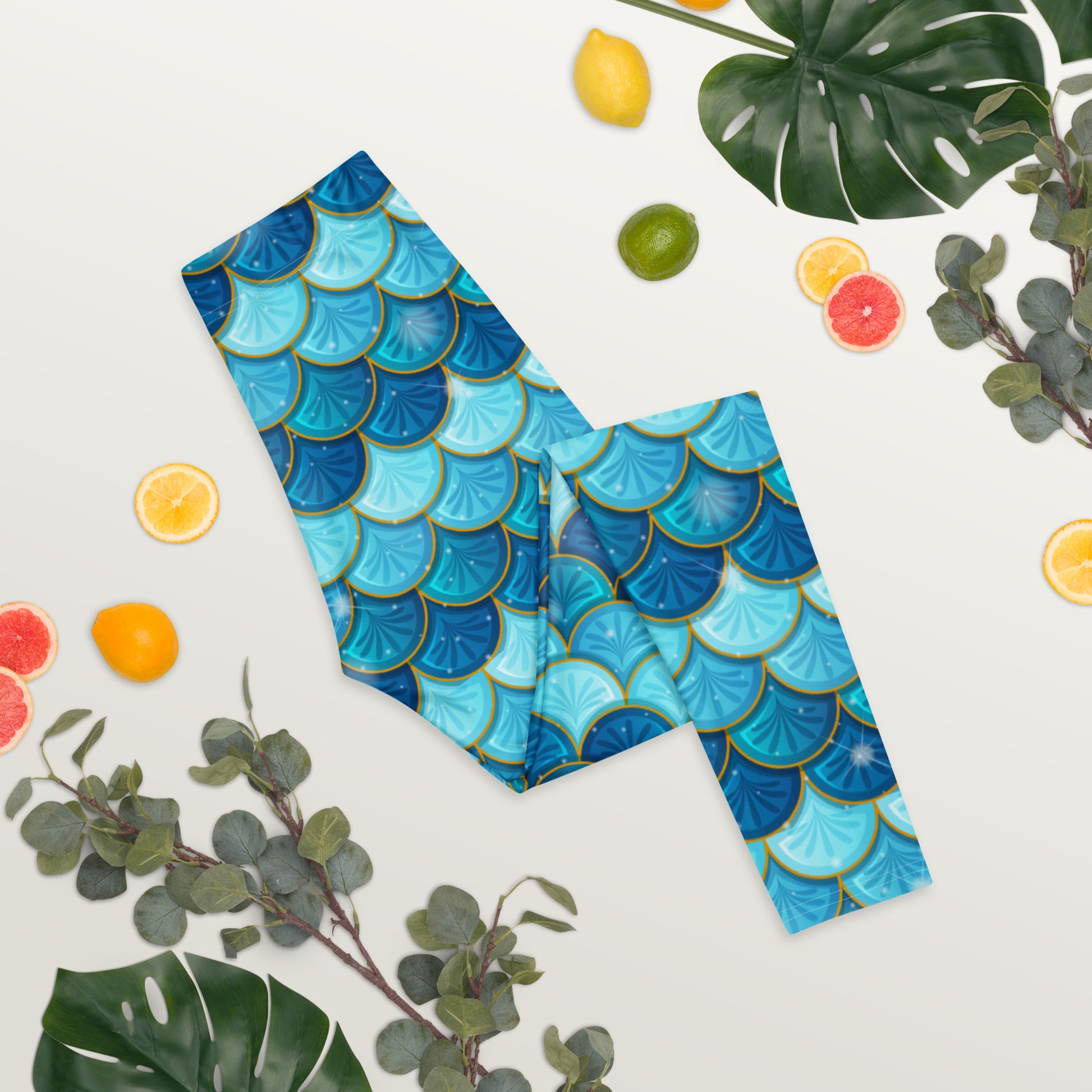 Image: Blue Mermaid Scales Leggings for Women. These mermaidcore aesthetic yoga pants have mermaid scales in shades of blue and teal with gold accents. Perfect for birthday parties, bachelorette parties, or Halloween mermaid costumes, by jaecrece