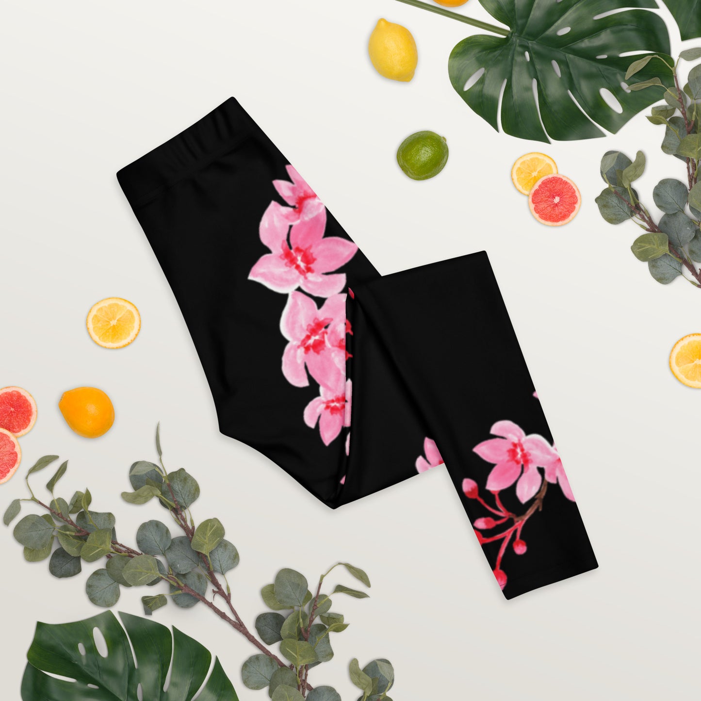 Image: Japanese Cherry Blossom Leggings. These black yoga pants have bright pink swirling down the legs. The perfect sakura gift for the Japanese cherry blossom lover in your life, by jaecrece