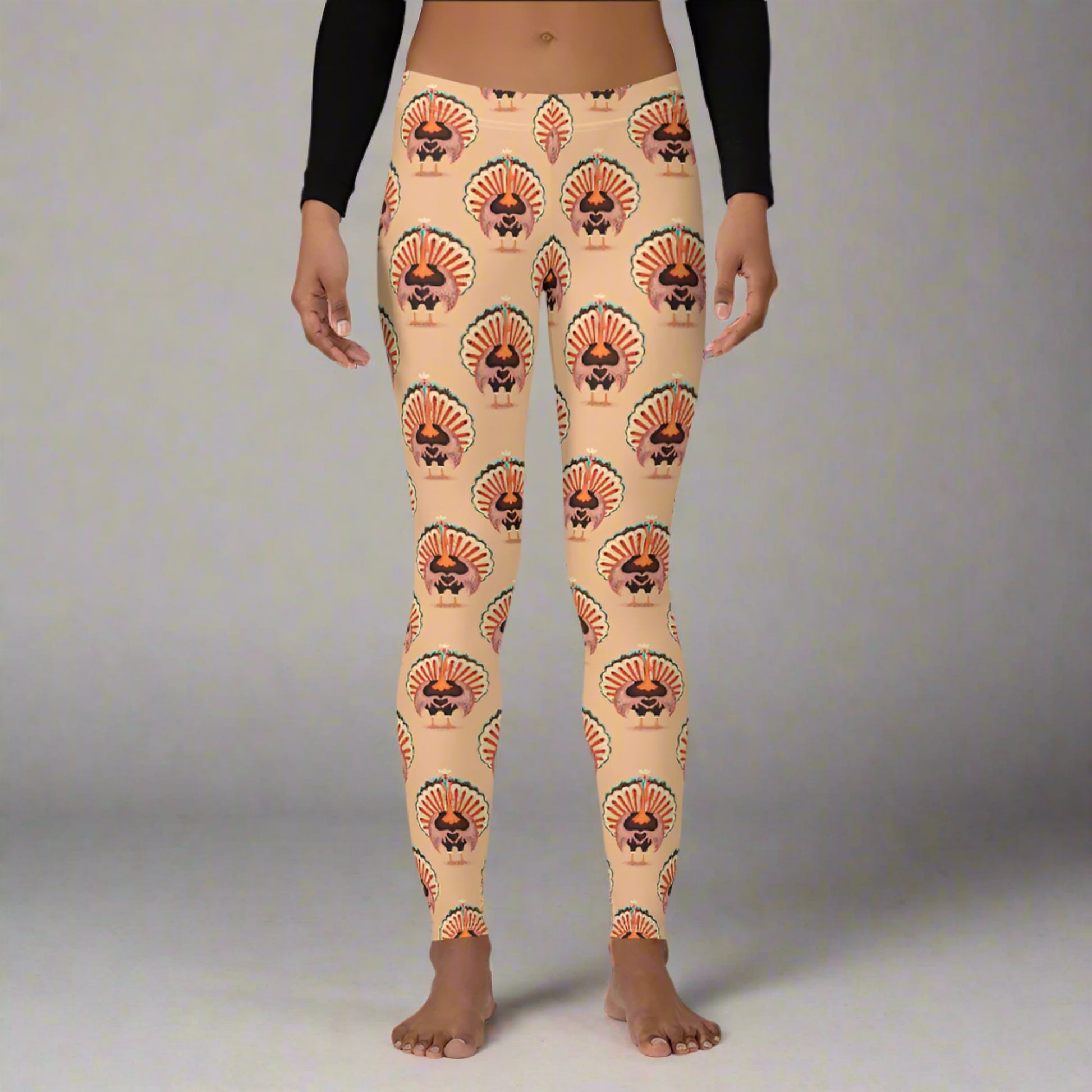 Thanksgiving Turkey Love ladies leggings. These womens yoga pants are peach, and have a repeating pattern of turkeys showing the love sign with their hands. These womens tights make a great gift, or a family matching outfit for the Turkey Trot! by jaecrece