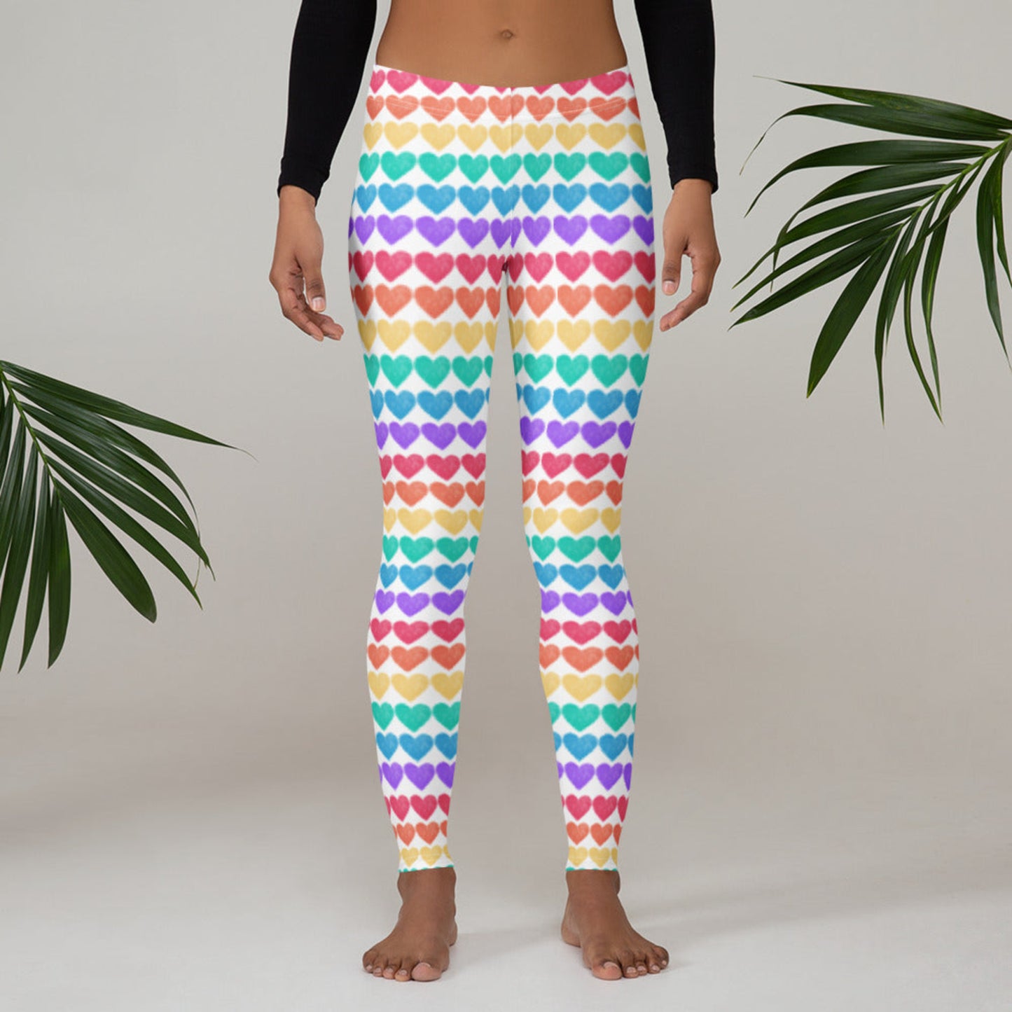 Let your style shine with Women’s Rainbow Hearts Leggings, designed for festival lovers, colorful souls, and Pride allies. Featuring rows of rainbow hearts on a soft, stretchy microfiber base, these full-length, mid-rise leggings are ready for anything. Wear them with confidence at 5Ks, carnivals, or creative family outings—toddler and youth sizes available for matching moments.