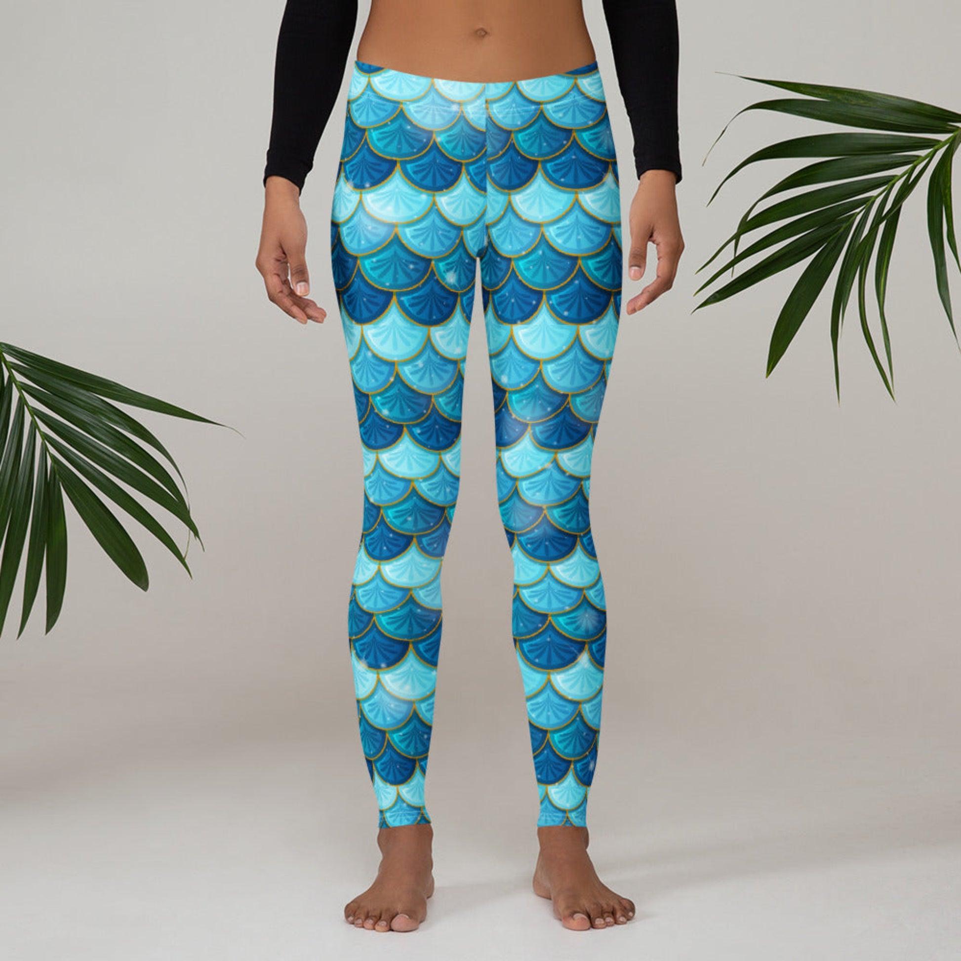 Image: Blue Mermaid Scales Leggings for Women. These mermaidcore aesthetic yoga pants have mermaid scales in shades of blue and teal with gold accents. Perfect for birthday parties, bachelorette parties, or Halloween mermaid costumes, by jaecrece