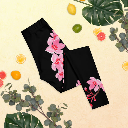 Image: Japanese Cherry Blossom Leggings. These black yoga pants have bright pink swirling down the legs. The perfect sakura gift for the Japanese cherry blossom lover in your life, by jaecrece