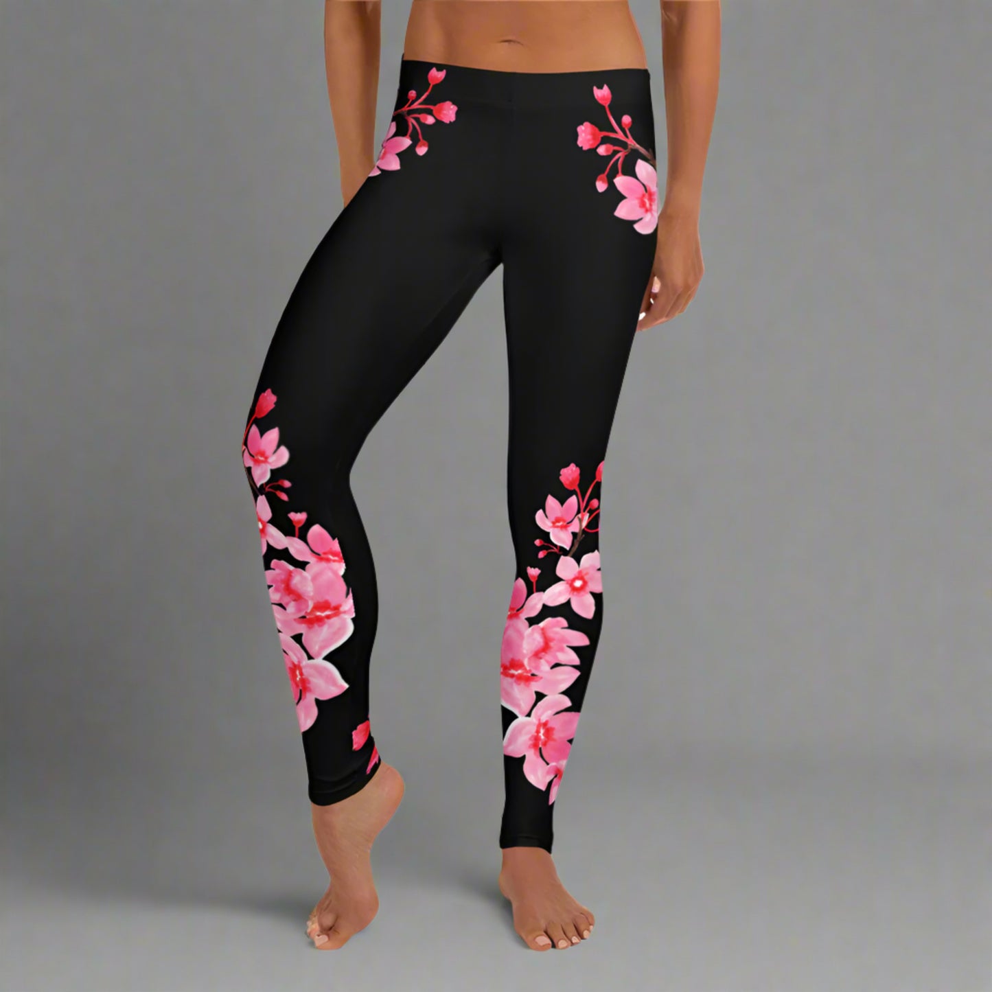 Image: Japanese Cherry Blossom Leggings. These black yoga pants have bright pink swirling down the legs. The perfect sakura gift for the Japanese cherry blossom lover in your life, by jaecrece