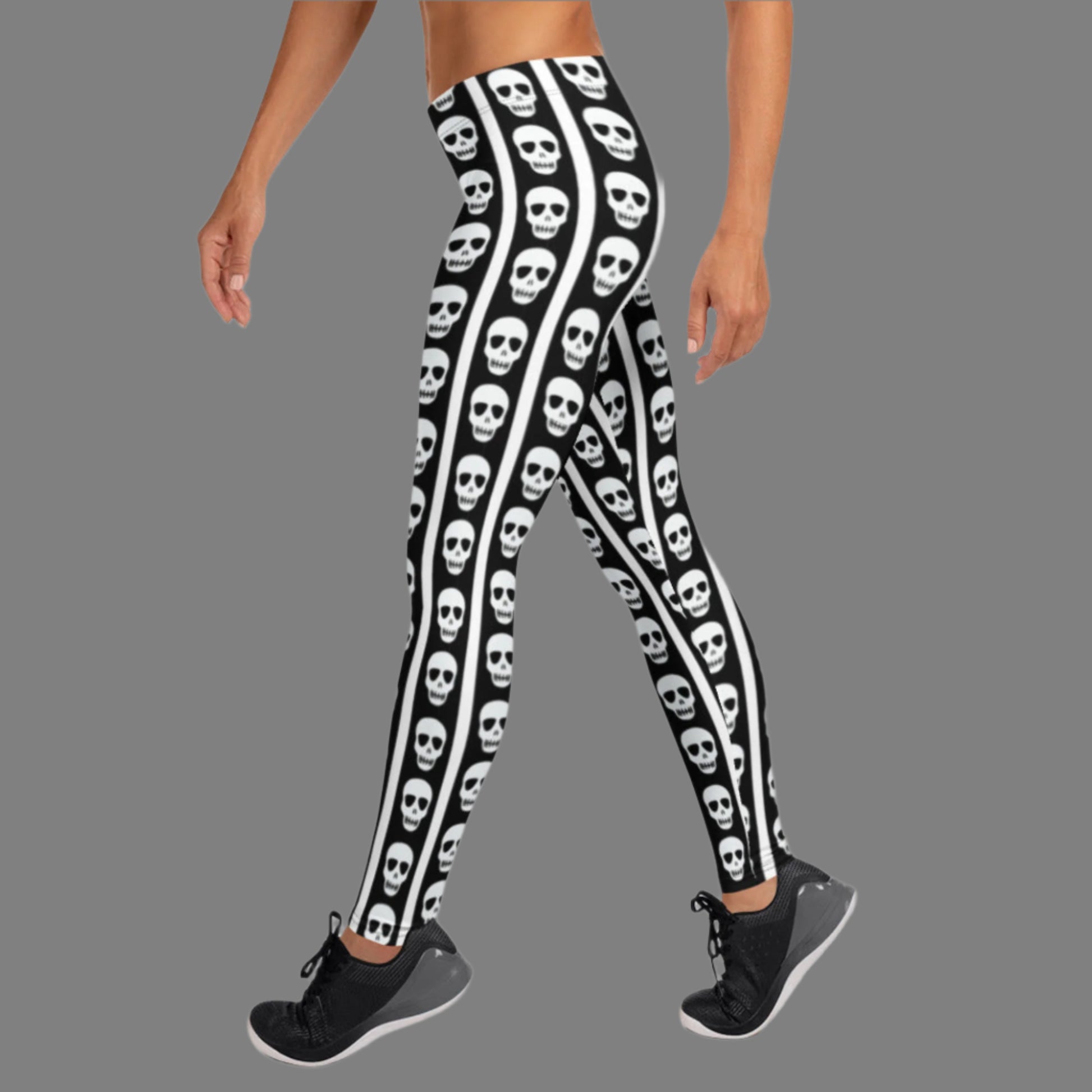Image: These skull print leggings offer a mix of bold contrast and playful edge. The black and white striped pattern gives a classic circus feel while skull graphics along the legs bring a dark twist. Available in XS to XL, these women’s leggings are perfect for themed parties, unique streetwear looks, or anyone embracing bold fashion with personality, by jaecrece.