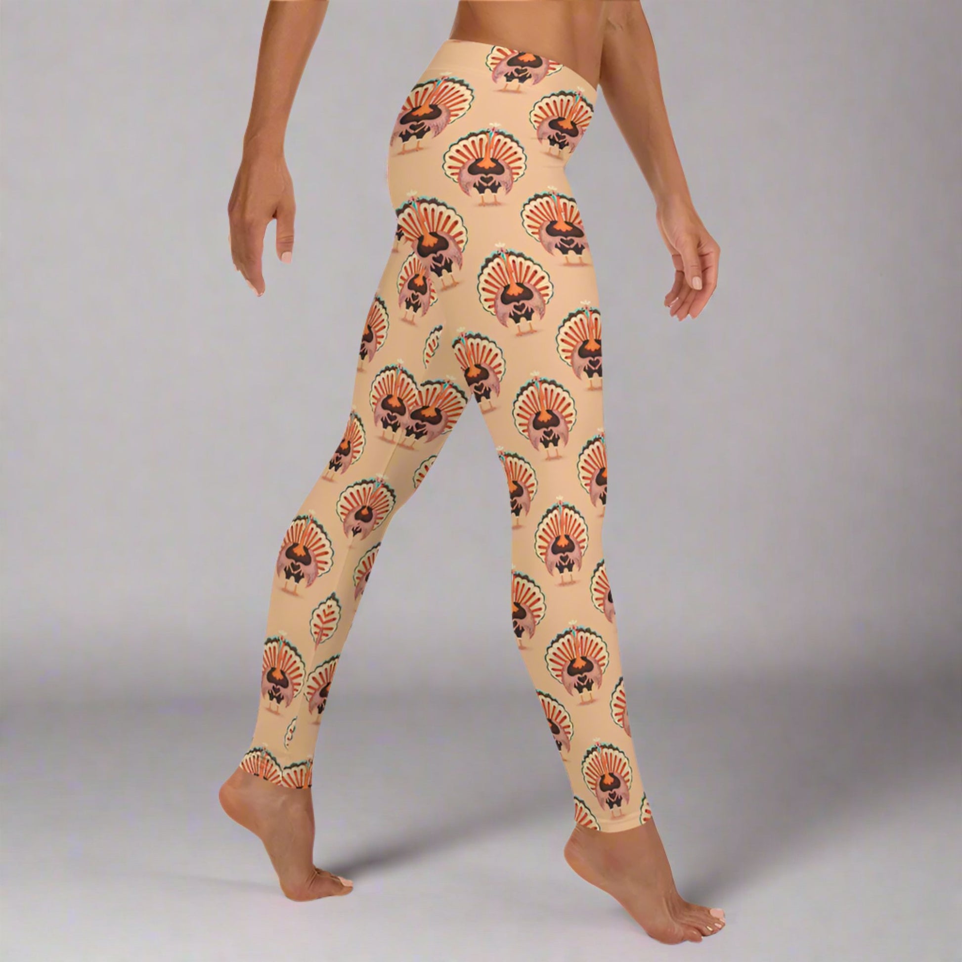 Thanksgiving Turkey Love ladies leggings. These womens yoga pants are peach, and have a repeating pattern of turkeys showing the love sign with their hands. These womens tights make a great gift, or a family matching outfit for the Turkey Trot! by jaecrece