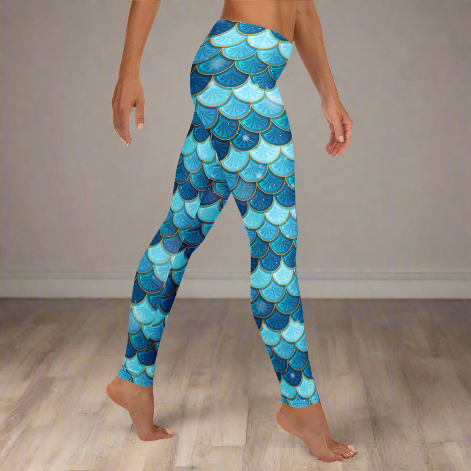 Image: Blue Mermaid Scales Leggings for Women. These mermaidcore aesthetic yoga pants have mermaid scales in shades of blue and teal with gold accents. Perfect for birthday parties, bachelorette parties, or Halloween mermaid costumes, by jaecrece