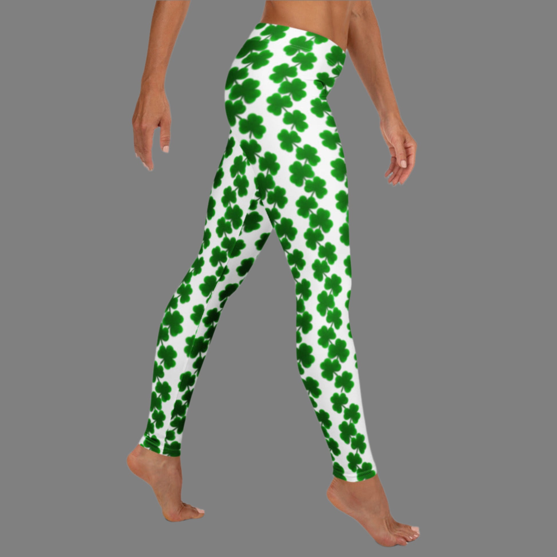 Image: St Patricks Day Leggings for women. These yoga pants are white with a green shamrock pattern. These shamrock print leggings for women feature a mid-rise waist and full-length fit, making them perfect for St. Patrick’s Day celebrations or cozy wear any time. The white background is accented with bright green shamrocks in a repeating chain pattern. Great for Irish-themed parties, March family photos, or matching with kids’ leggings for a mom-and-me holiday outfit.
