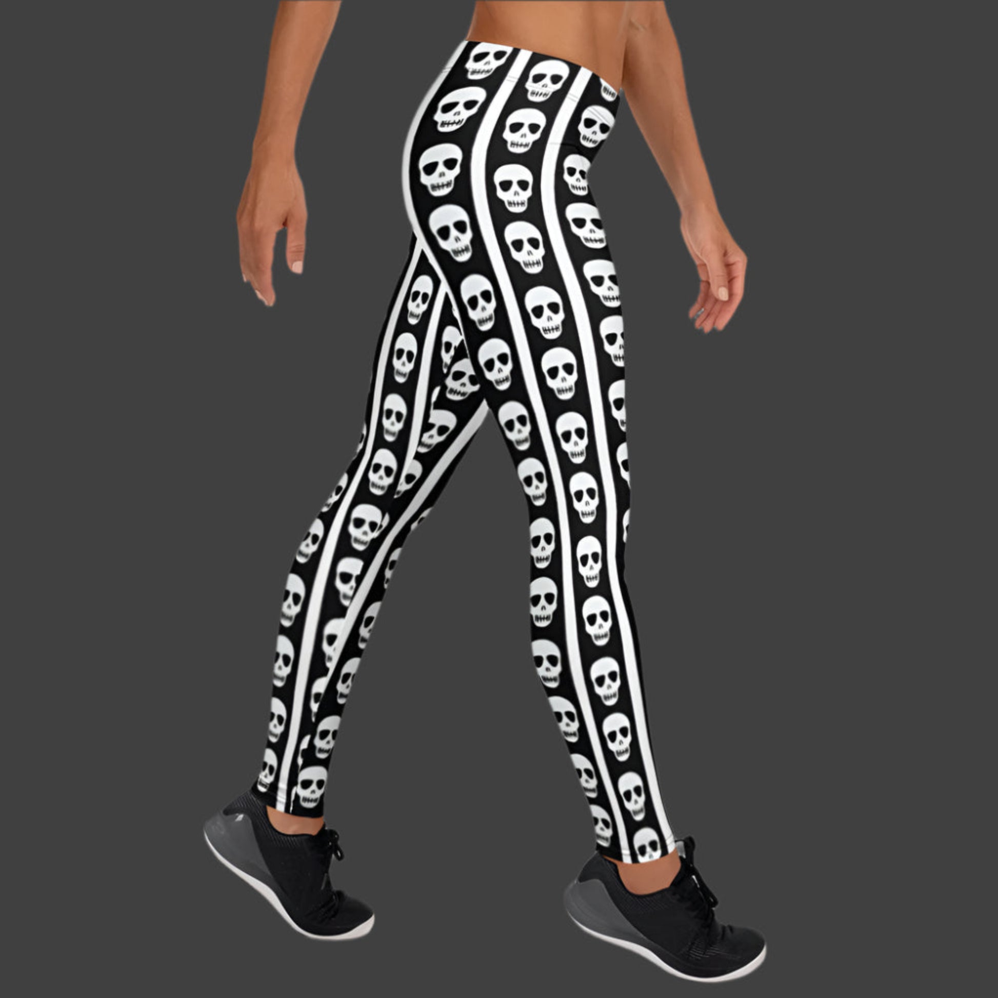Image: These skull print leggings offer a mix of bold contrast and playful edge. The black and white striped pattern gives a classic circus feel while skull graphics along the legs bring a dark twist. Available in XS to XL, these women’s leggings are perfect for themed parties, unique streetwear looks, or anyone embracing bold fashion with personality, by jaecrece.